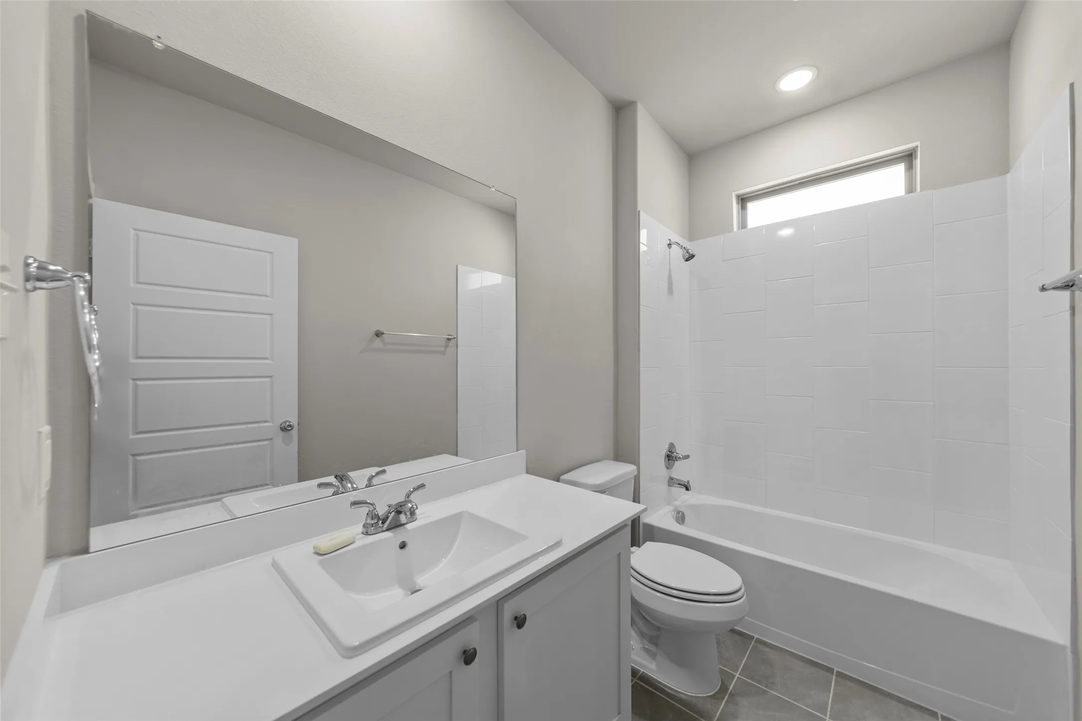 Vanity with an integrated sink and chrome faucet