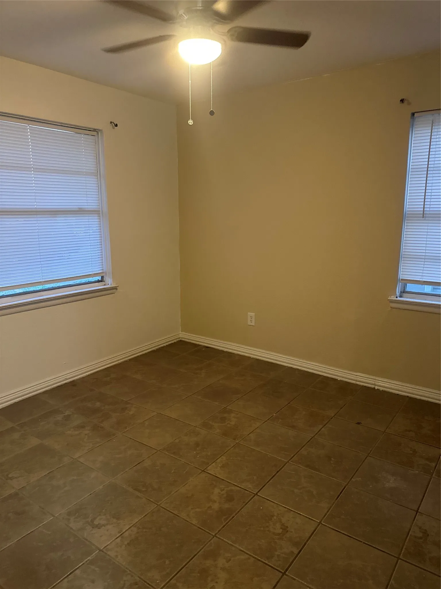Tile flooring and a ceiling fan with integrated lighting