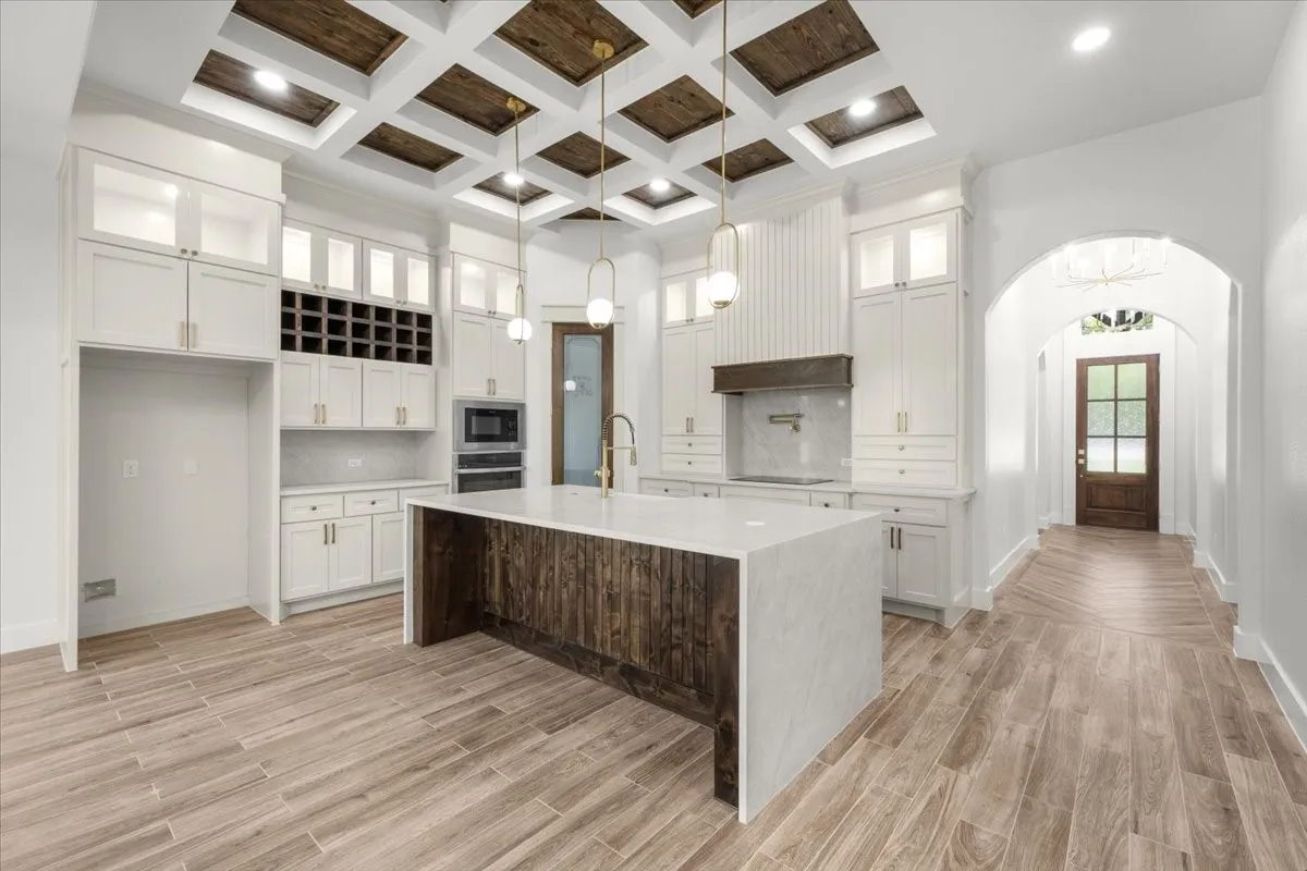 Coffered ceiling with wood-finish panels and recessed lighting