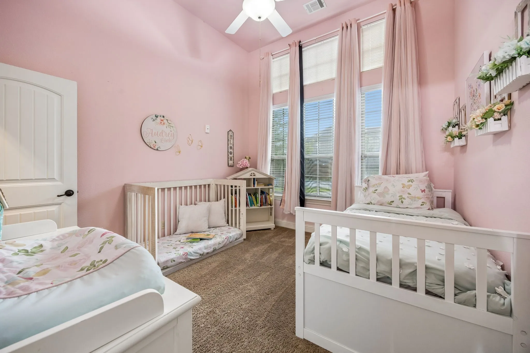 First-floor secondary bedroom offers flexibility for family, guests or additional workspace.