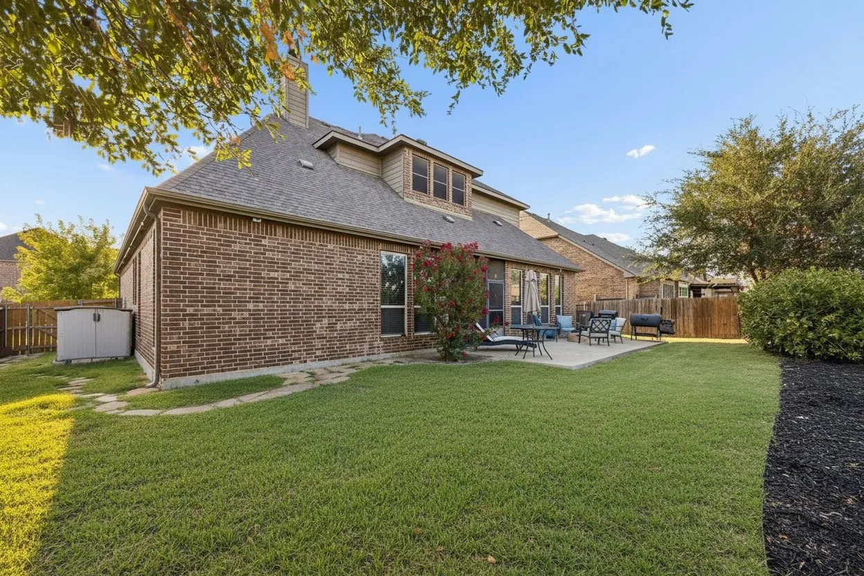 Backyard backs to a greenbelt with wrought iron rear fencing, creating an open backdrop with no immediate rear neighbor.