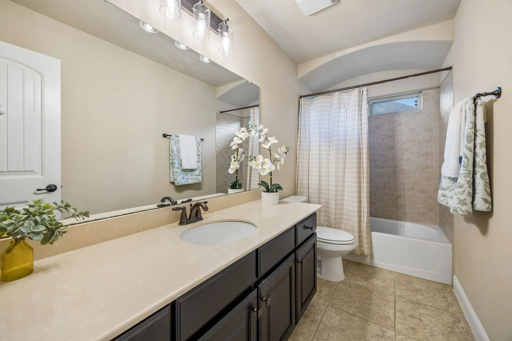 Full upstairs bathroom conveniently serves the fourth bedroom and game room.