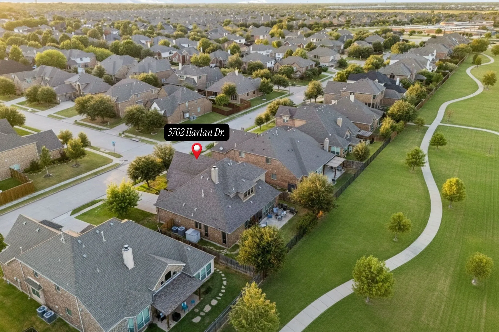 Aerial view illustrates the property's direct relationship to the greenbelt and nearby open space.