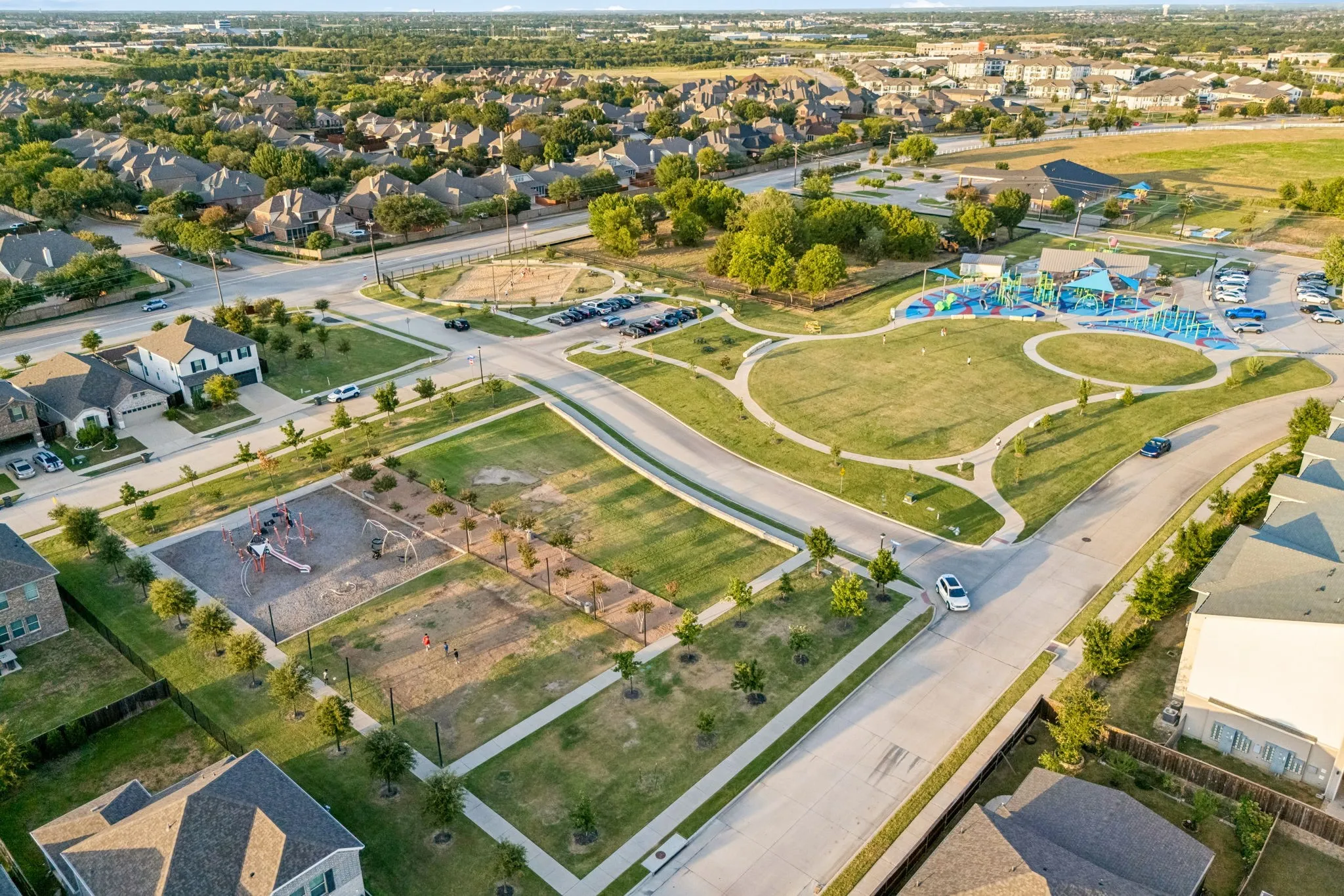 Wide aerial view provides perspective on the neighborhood, green space and surrounding Sachse area.