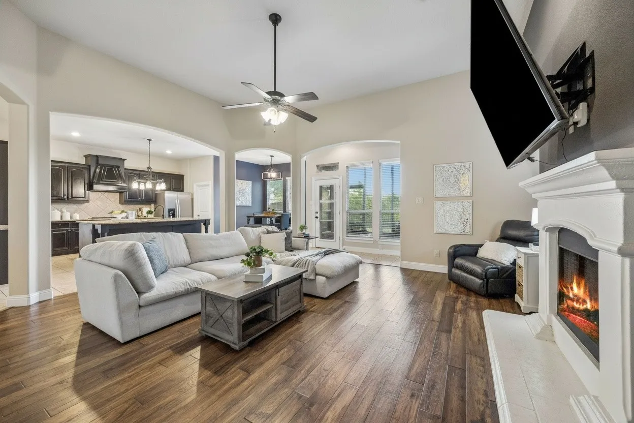 Another view of the open family room highlights the home's spacious layout and connection to the kitchen.