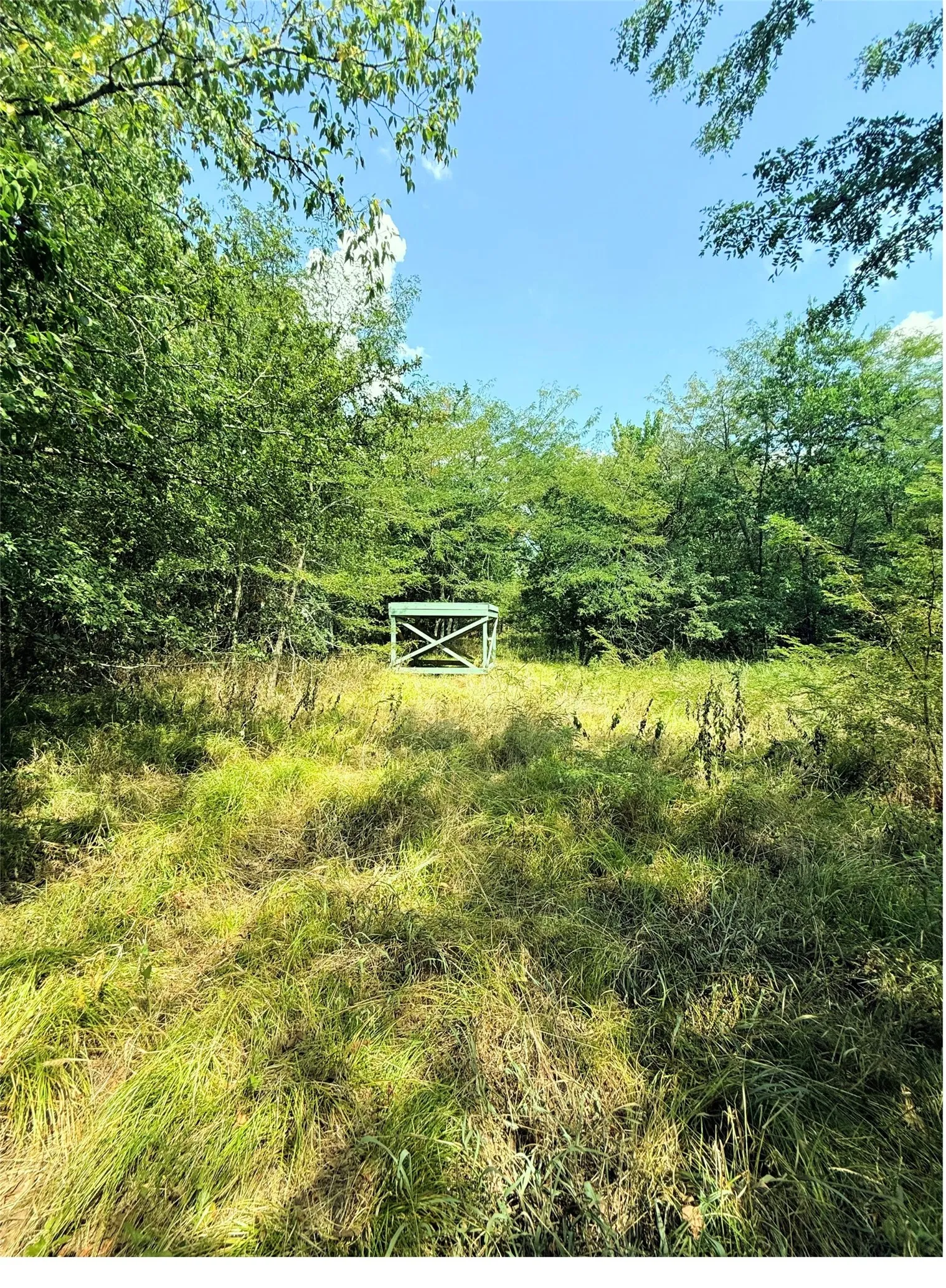 Property view with an observation tower and hunting stand
