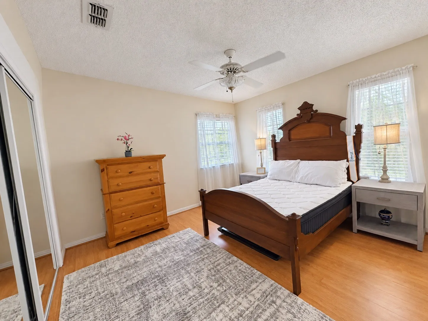 Light-toned walls complement wood-finish flooring