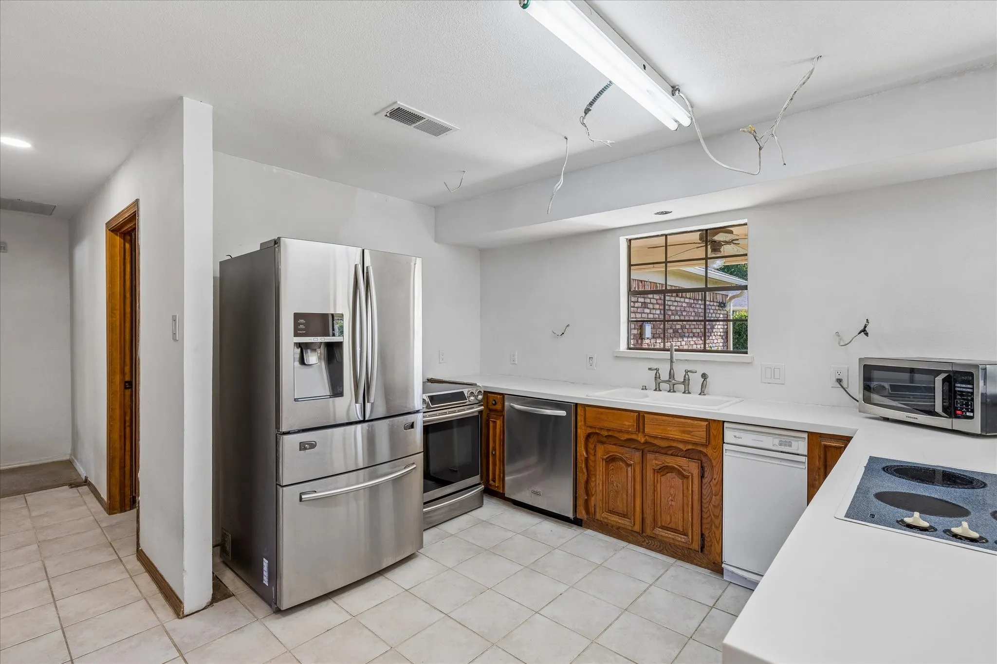 House originally had double ovens. Range was temporarily install once renovations were halted because of family member illness.
