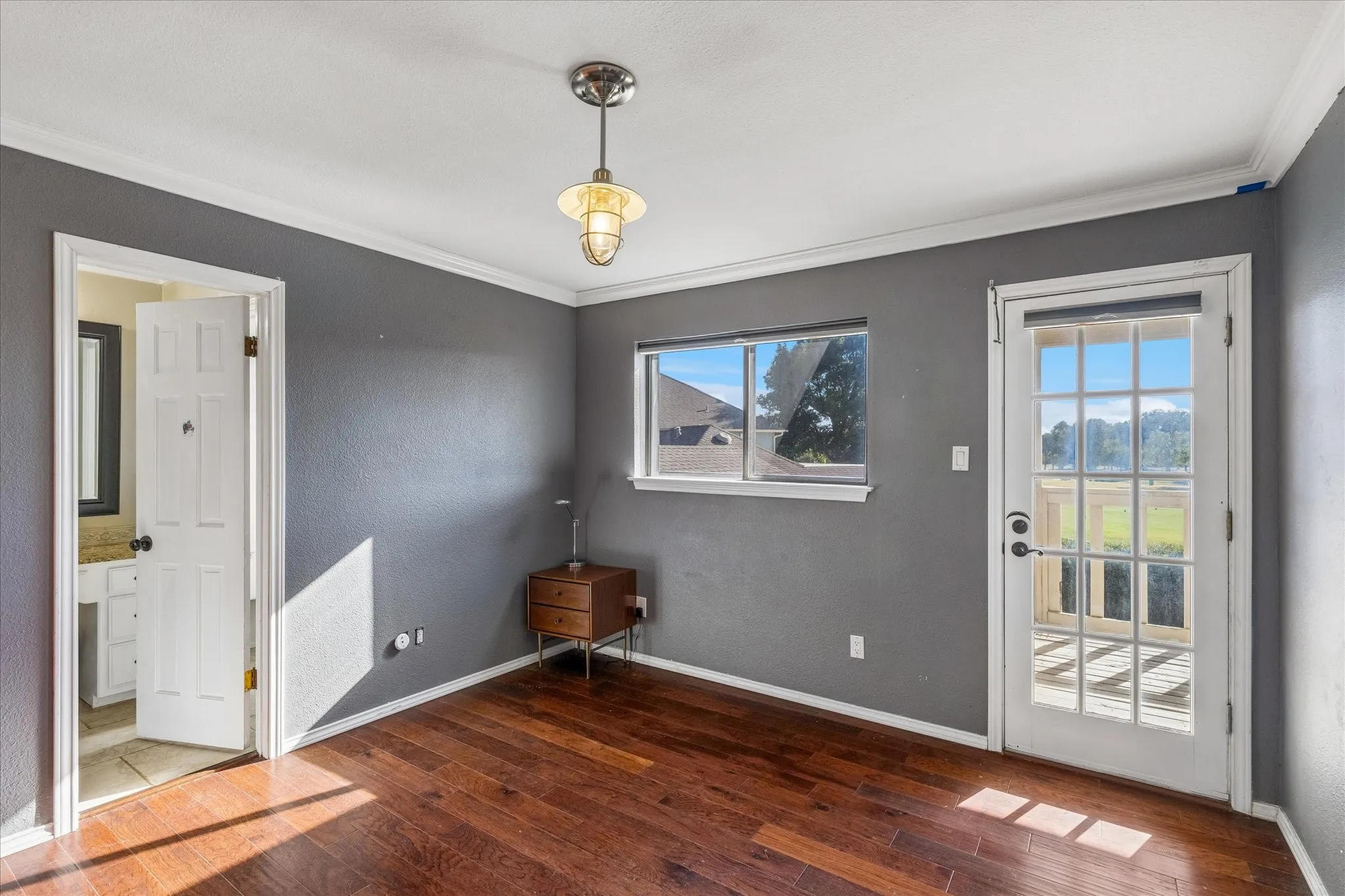 Second floor. Pass through bedroom open to balcony and bathroom shared with 4th bedroom. Bathroom has separate shower area for sharing.