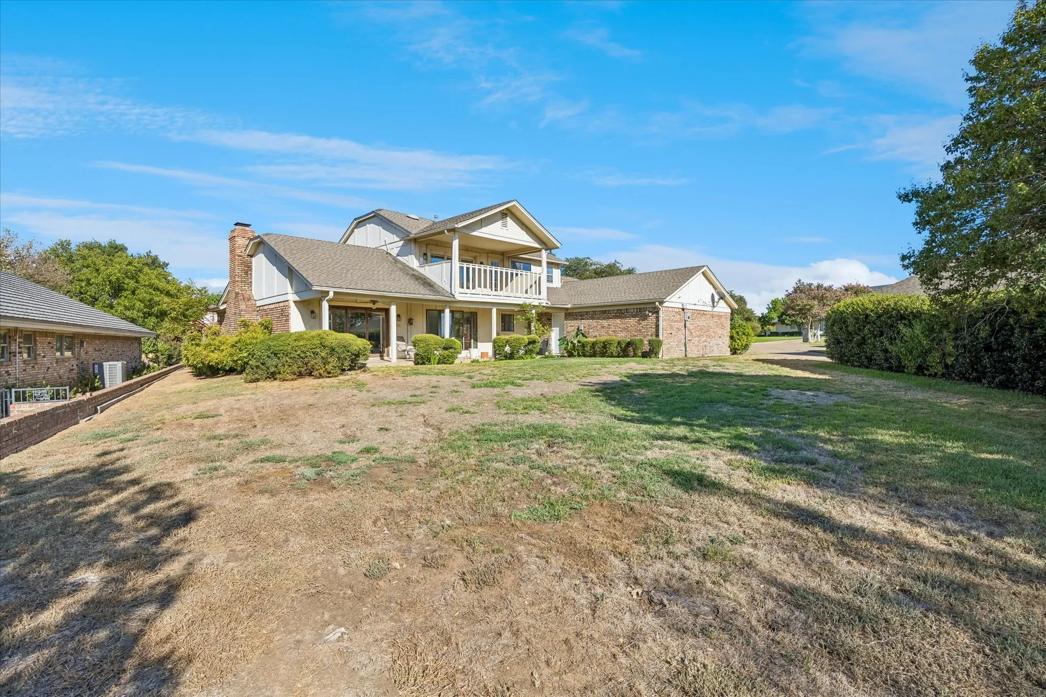 Large backyard ready for a pool is wanted. Nice covered patio space with balcony for evening sunsets and watching the golfers.