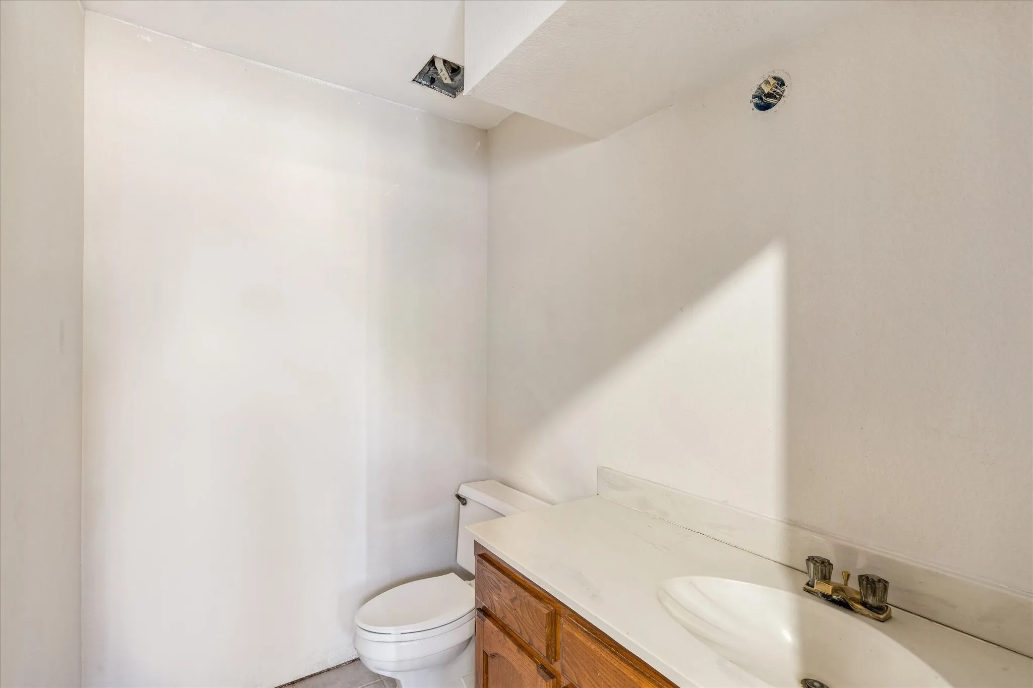 Large 1/2 bath in entry for guests.