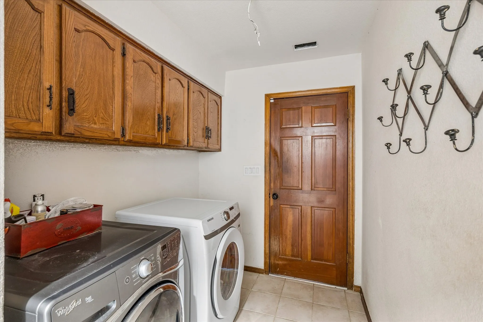 Laundry area leading to garage. This room also has a closet.