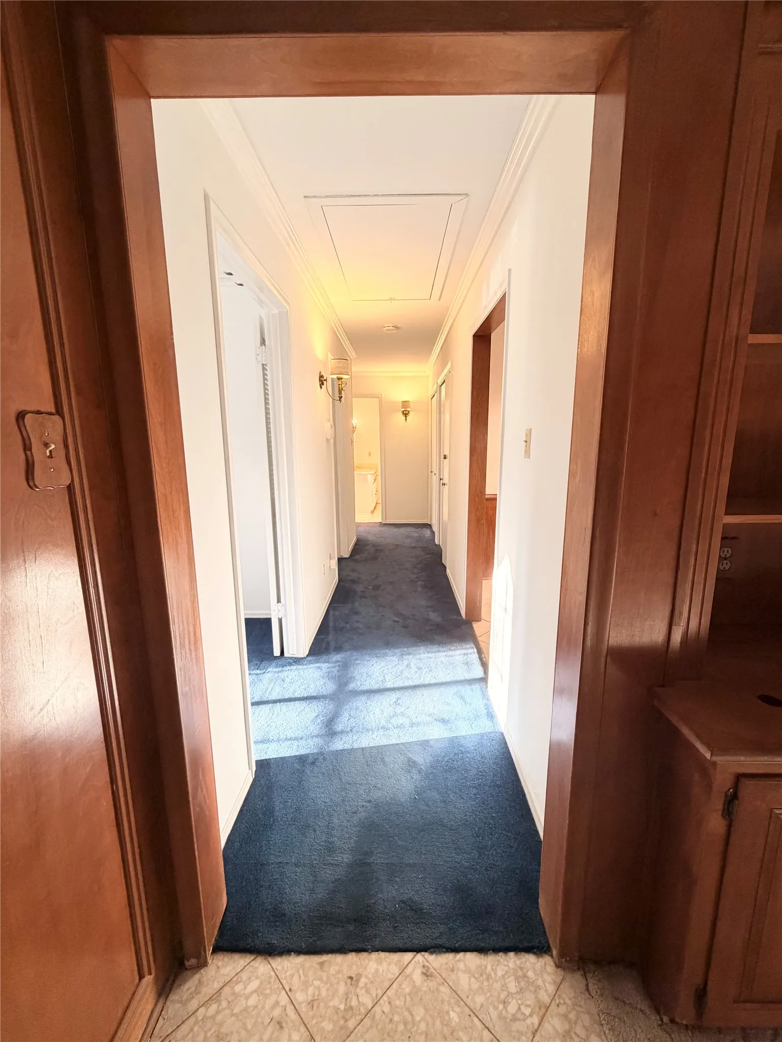 Hallway on Left to Guest & Laundry