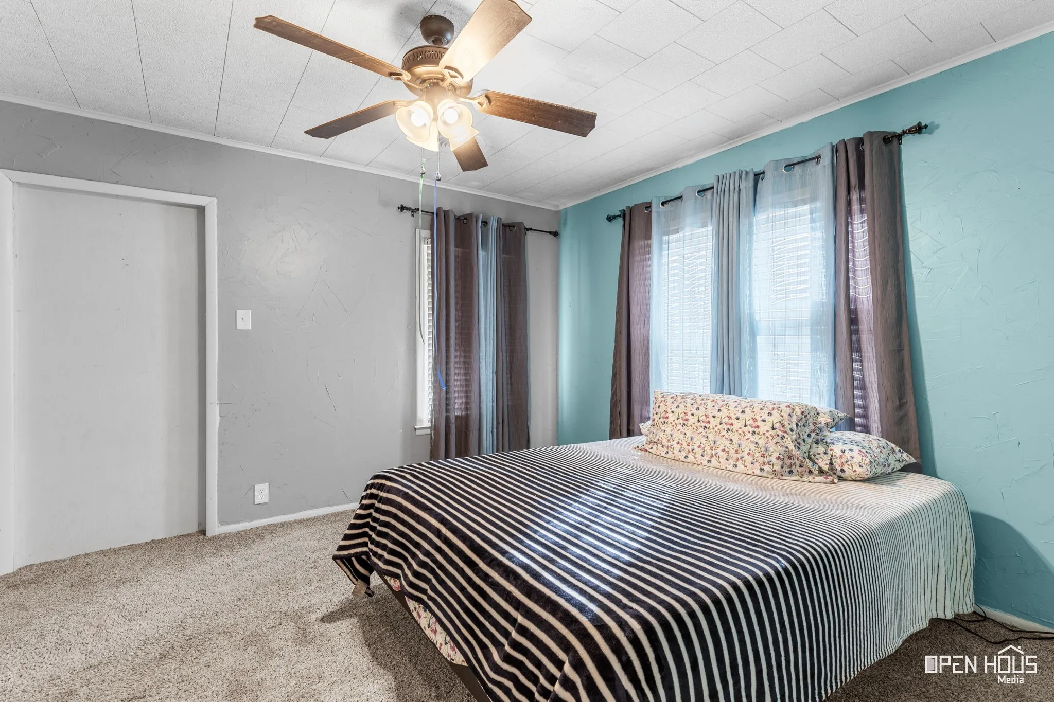 Recessed windows with blinds, ceiling fan with light fixture, wall-to-wall carpeting, and a built-in door