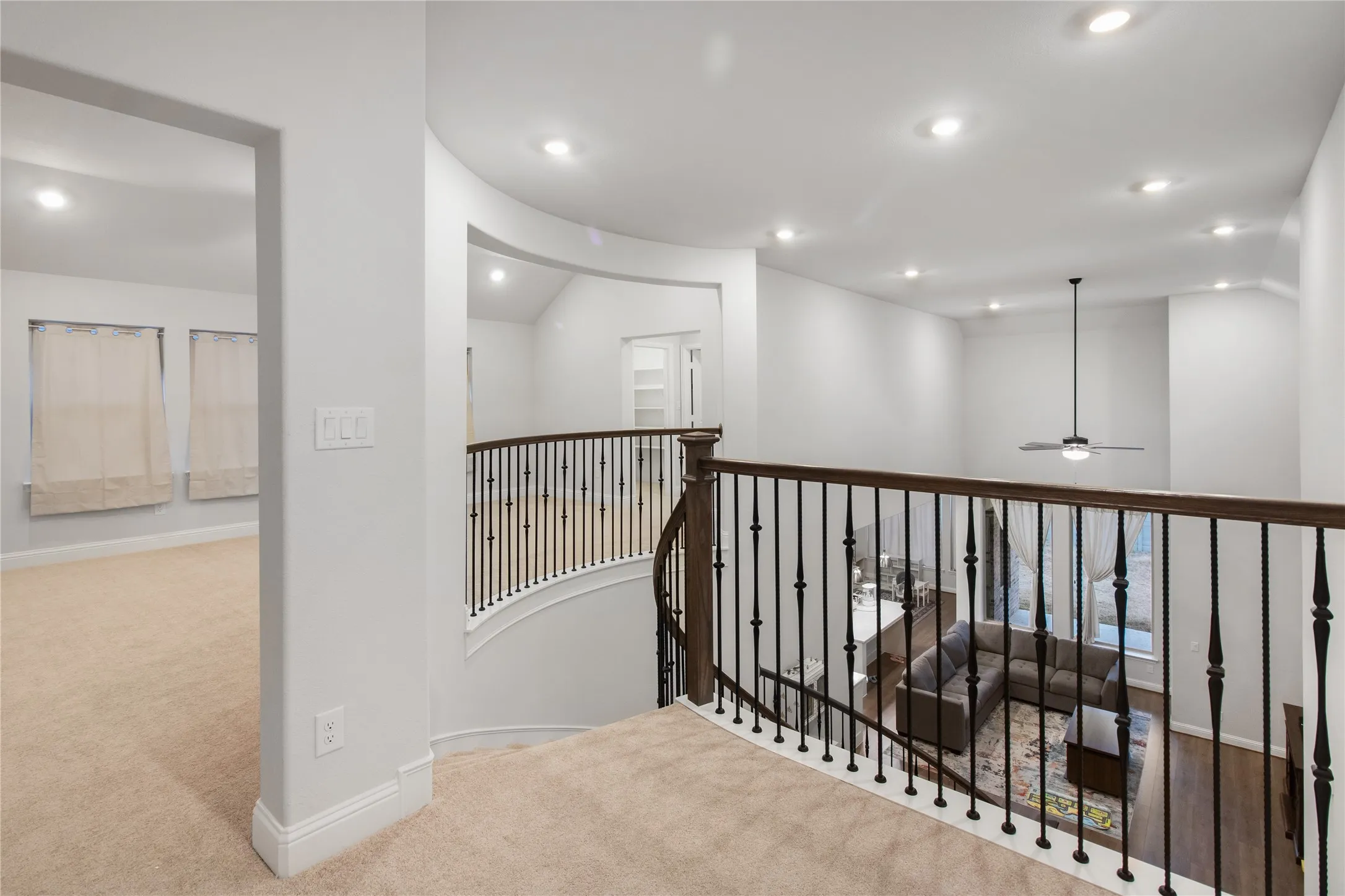 Upper-level landing with carpeted flooring