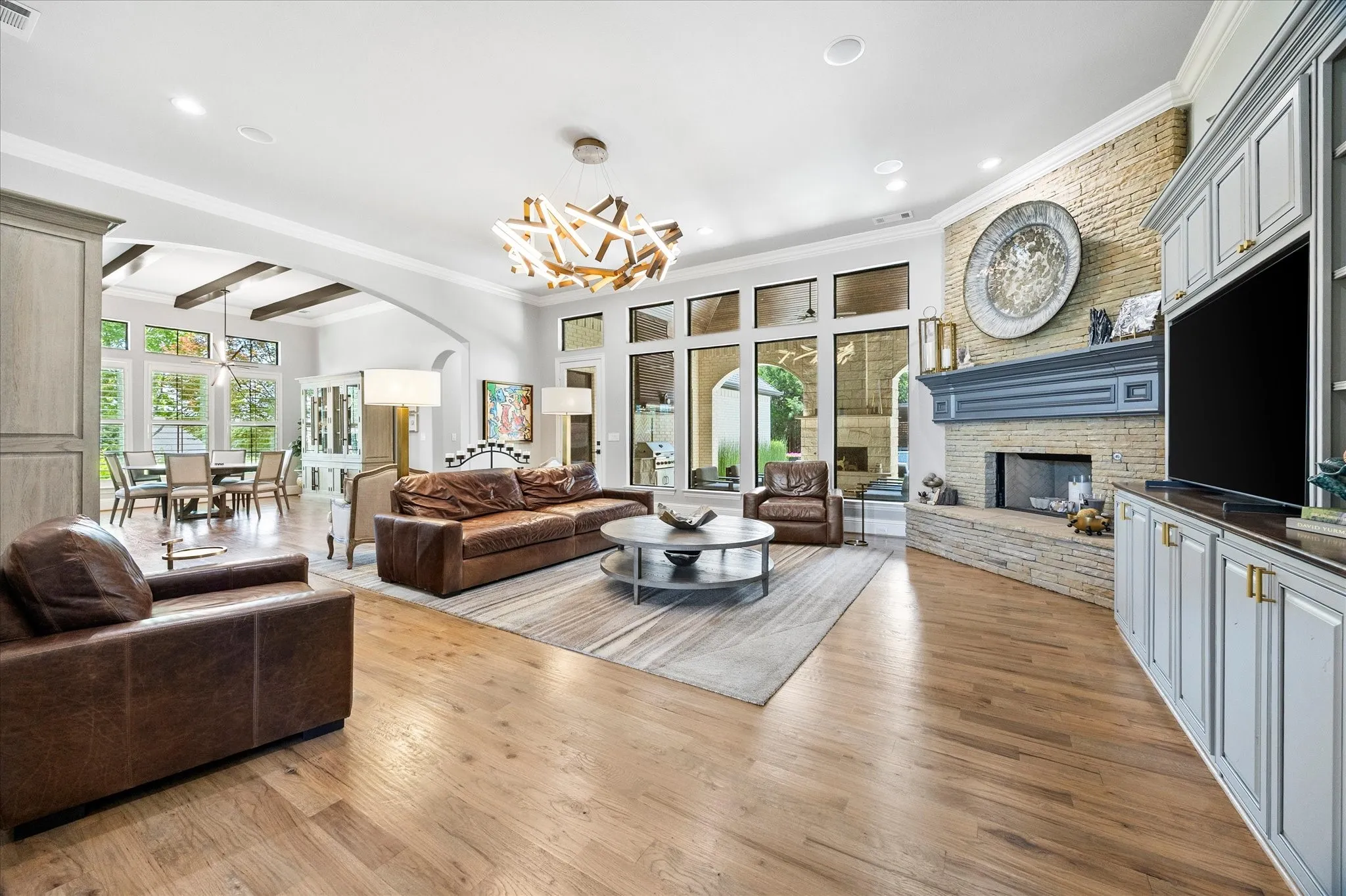 Spacious interior featuring wood-finish flooring and an open archway