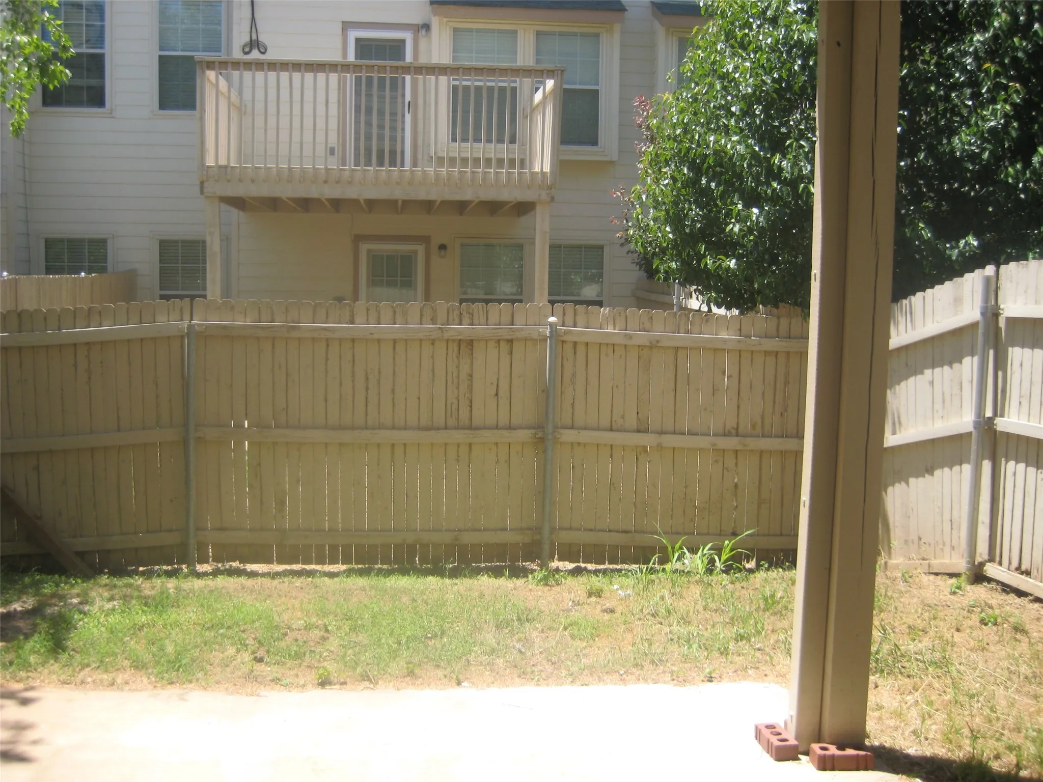 One year old deck and fence with a small amount of yard