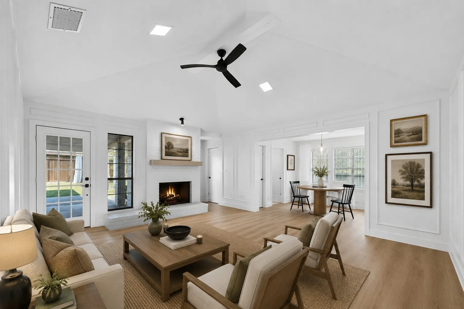 Vaulted ceiling with a ceiling fan, recessed lighting, fireplace with a wood-finish mantel, wood-finish flooring, and a glass-paneled door