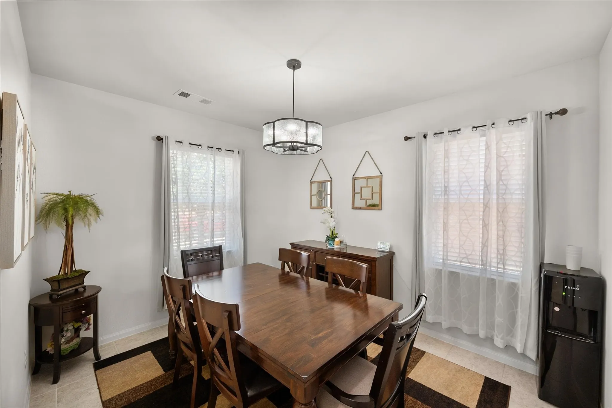 Recessed lighting, tiled flooring, and a modern ceiling light fixture