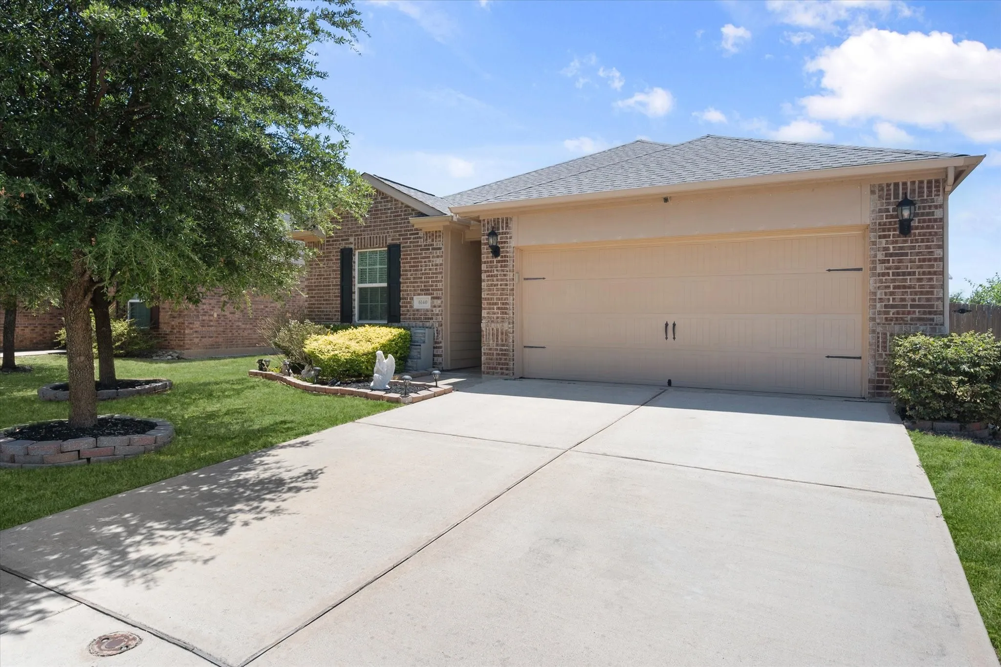 Brick exterior with a two-car garage