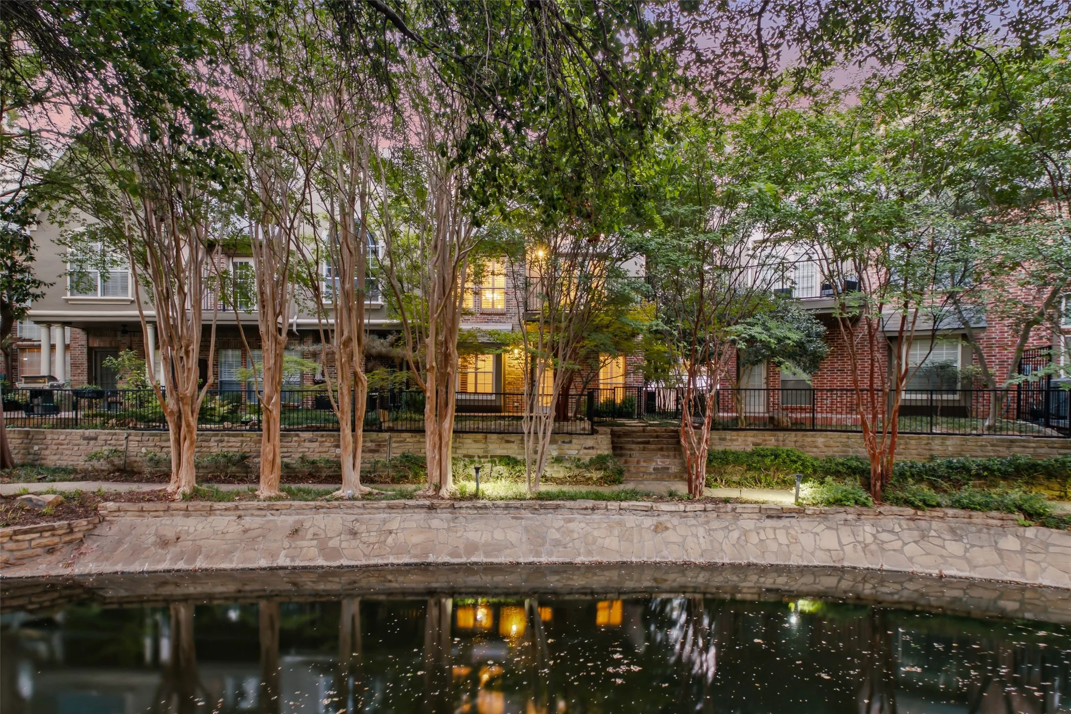 Water feature with stone retaining wall