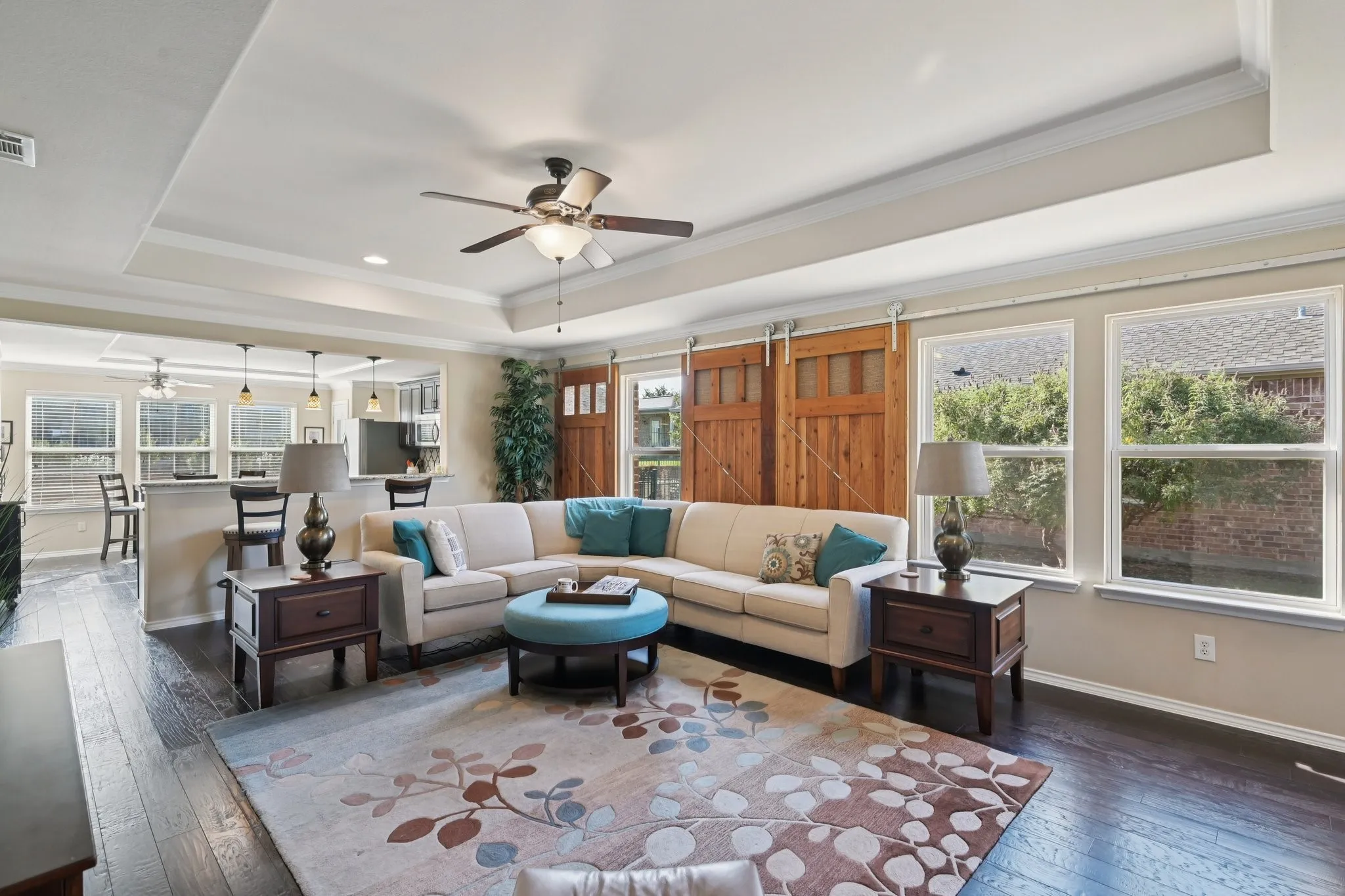 Open concept living room and kitchen - flooded with natural light