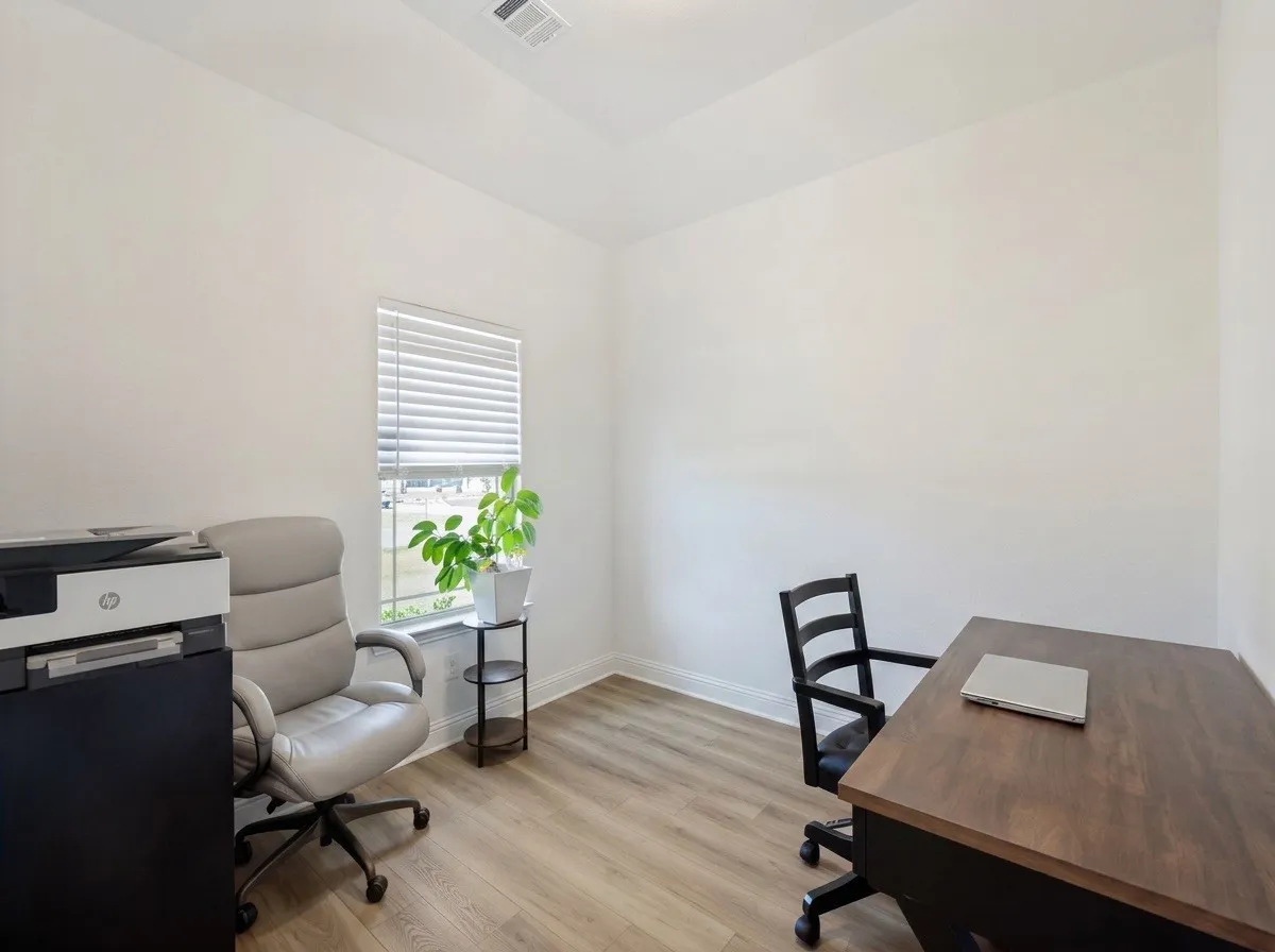 Wood-finish flooring, white walls, and a window with horizontal blinds