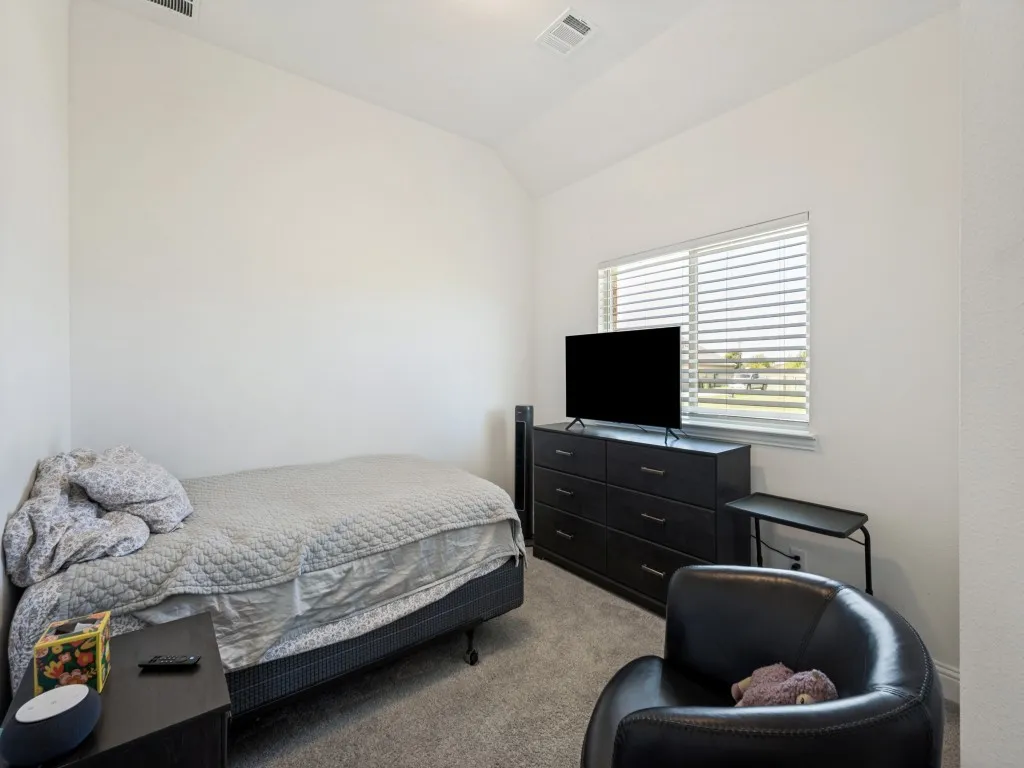Downstairs Guest Bedroom. Recessed lighting fixture, light gray carpet, white painted walls, and window with blinds
