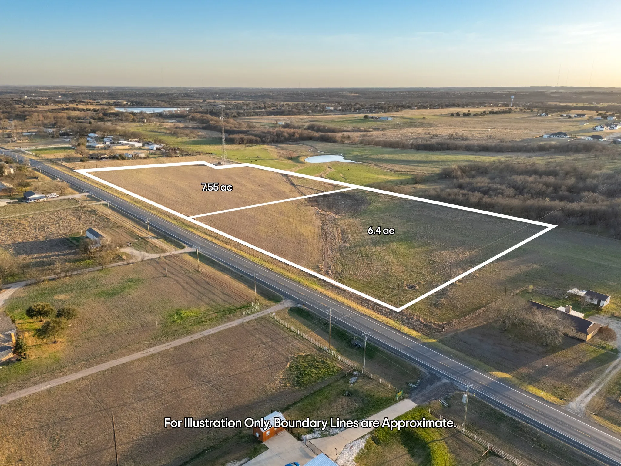 Expansive acreage featuring 7.55 acres and 6.4 acres of open land, with a paved road frontage