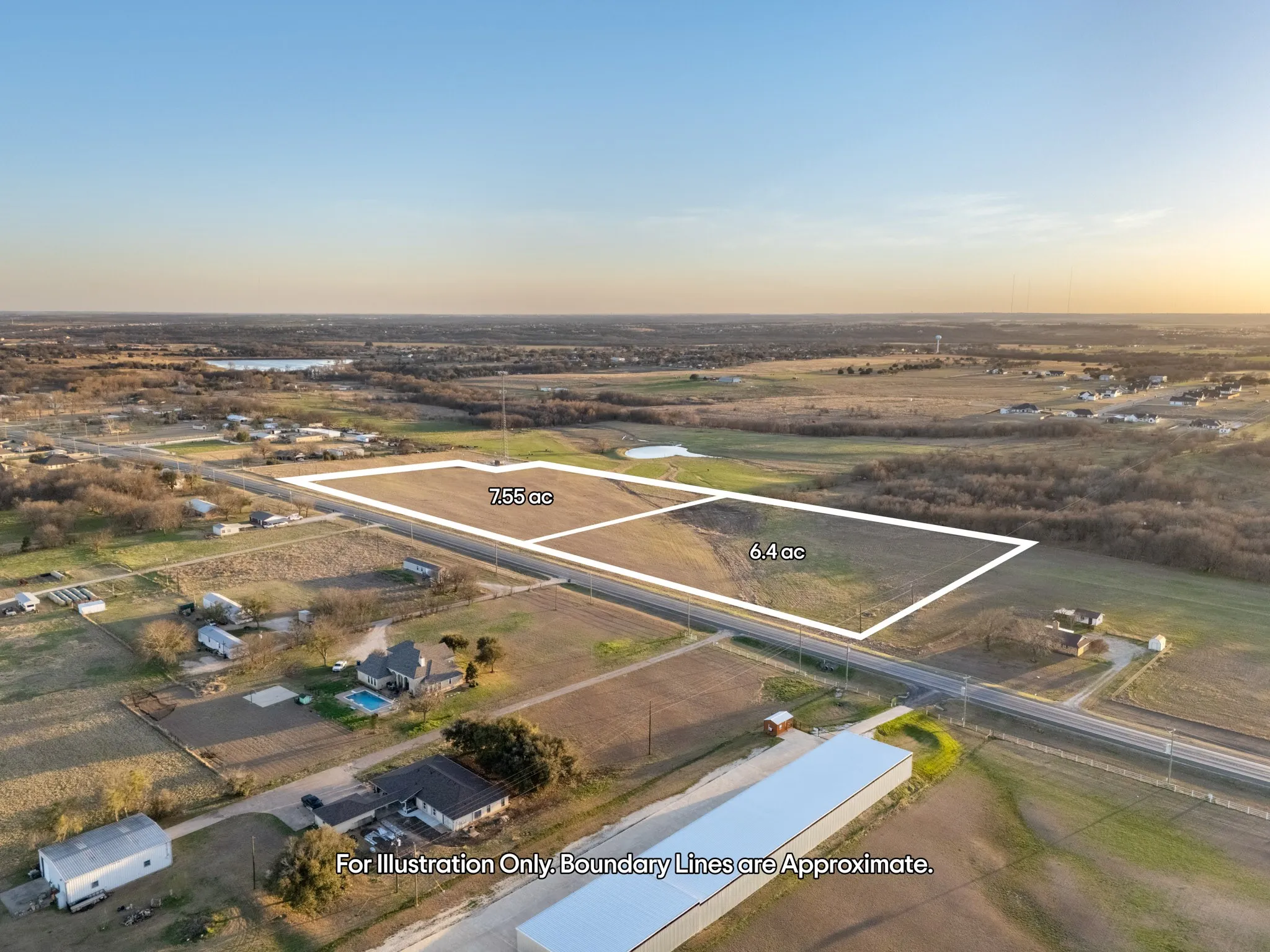 Expansive open land parcels totaling 7.55 acres and 6.4 acres, featuring cleared ground and road frontage