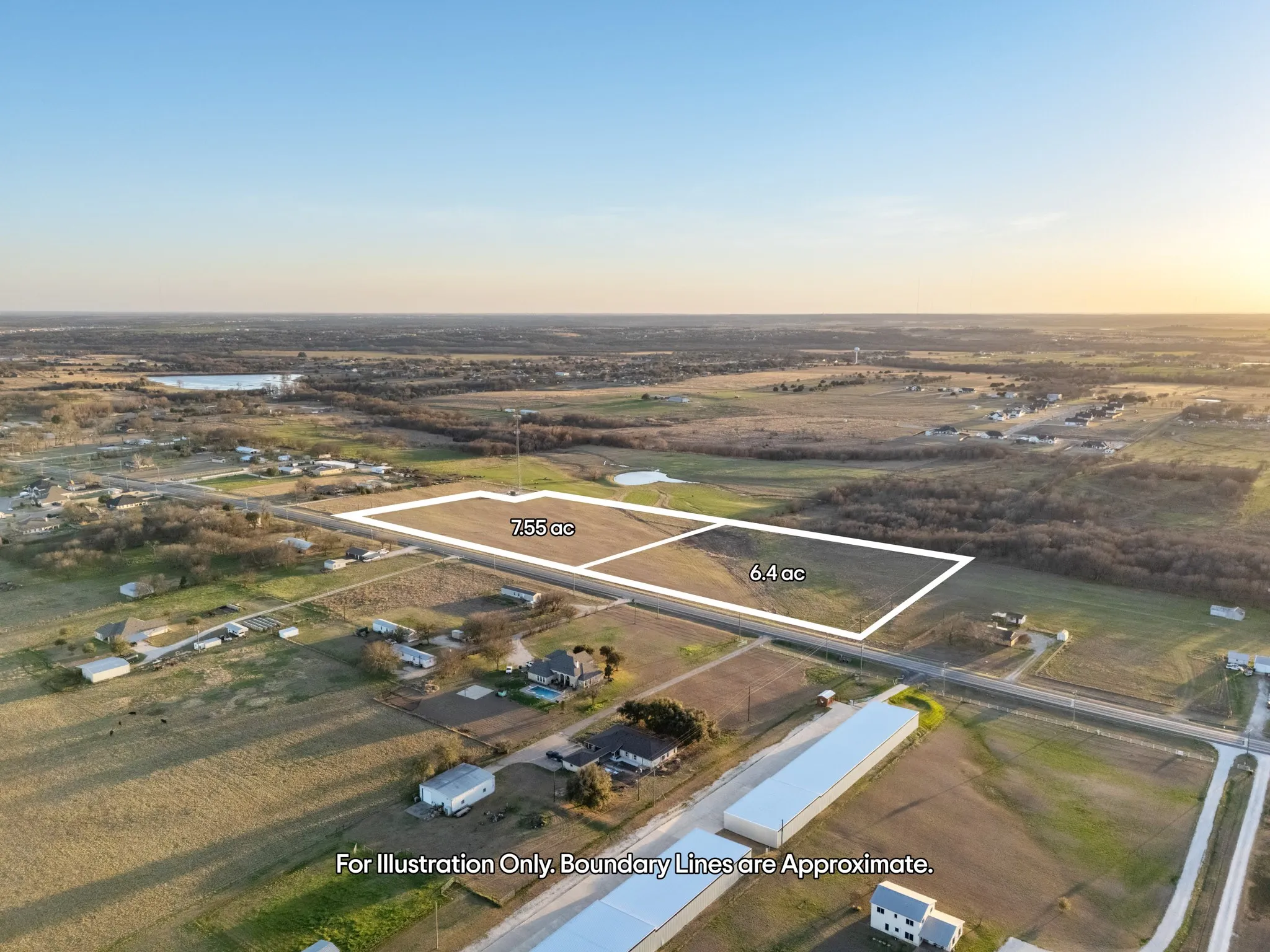 Expansive undeveloped land parcels with clear boundaries, bordered by paved roadways