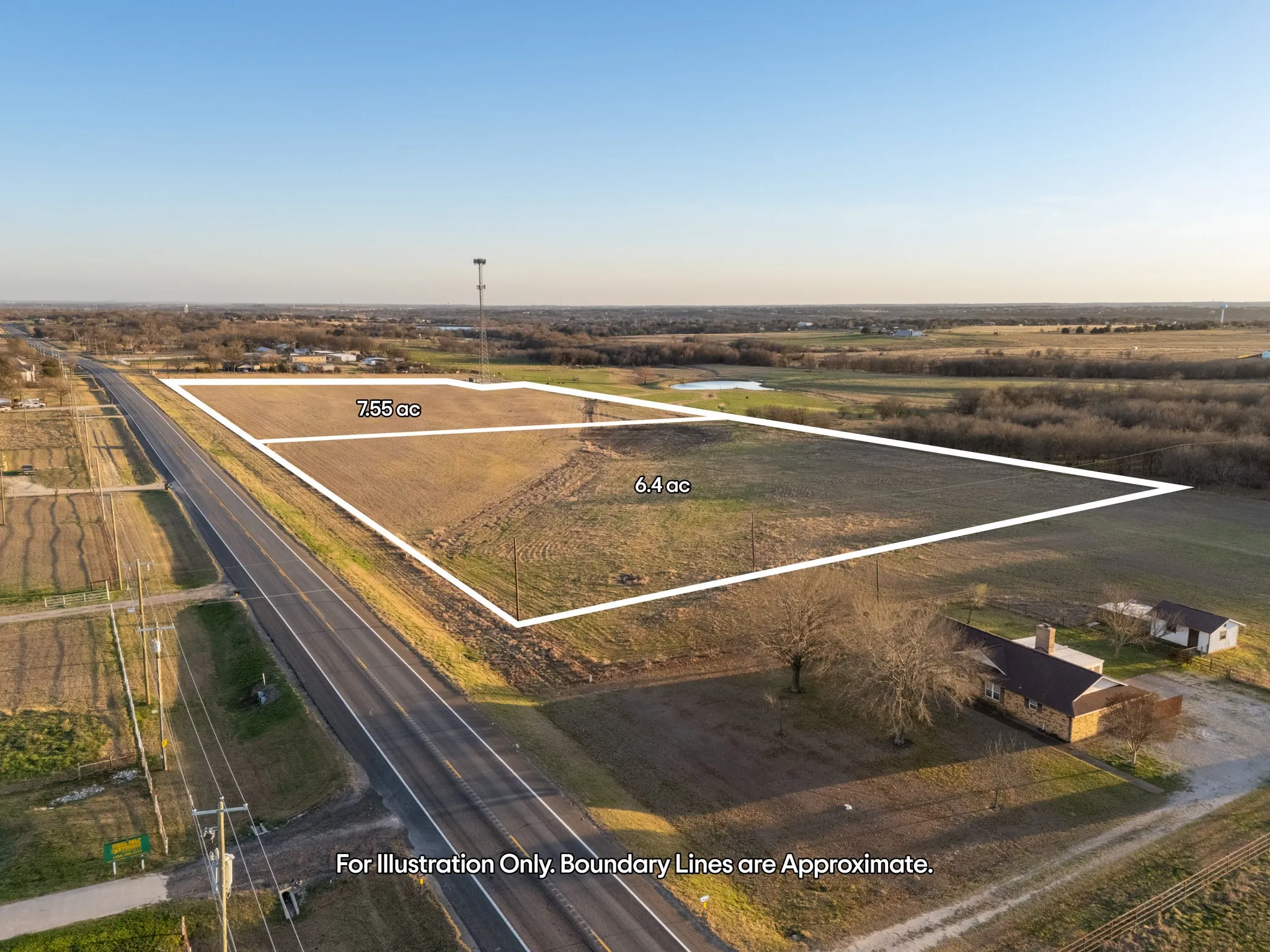 Expansive raw land parcel with direct road frontage and natural tree coverage