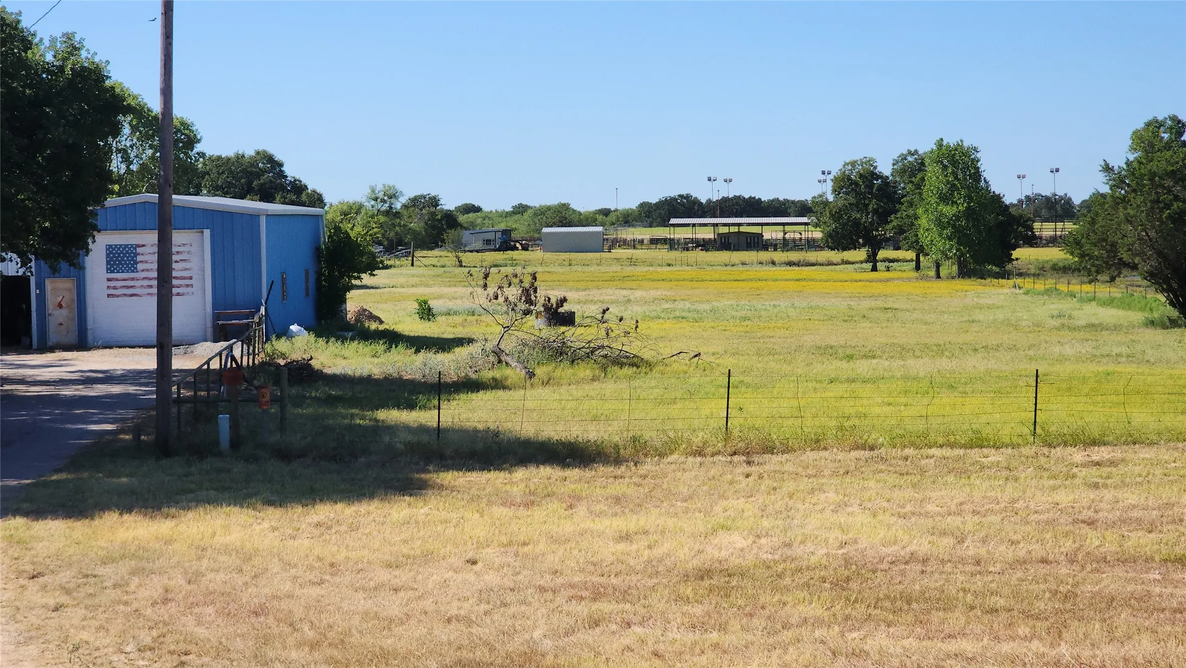 Blue building is the Shop property goes to the back fence