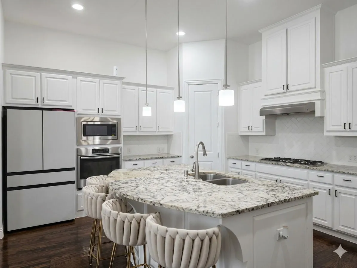 Kitchen featuring an expansive island with a double basin sink, white cabinetry, stainless steel appliances, and wood-finish flooring
