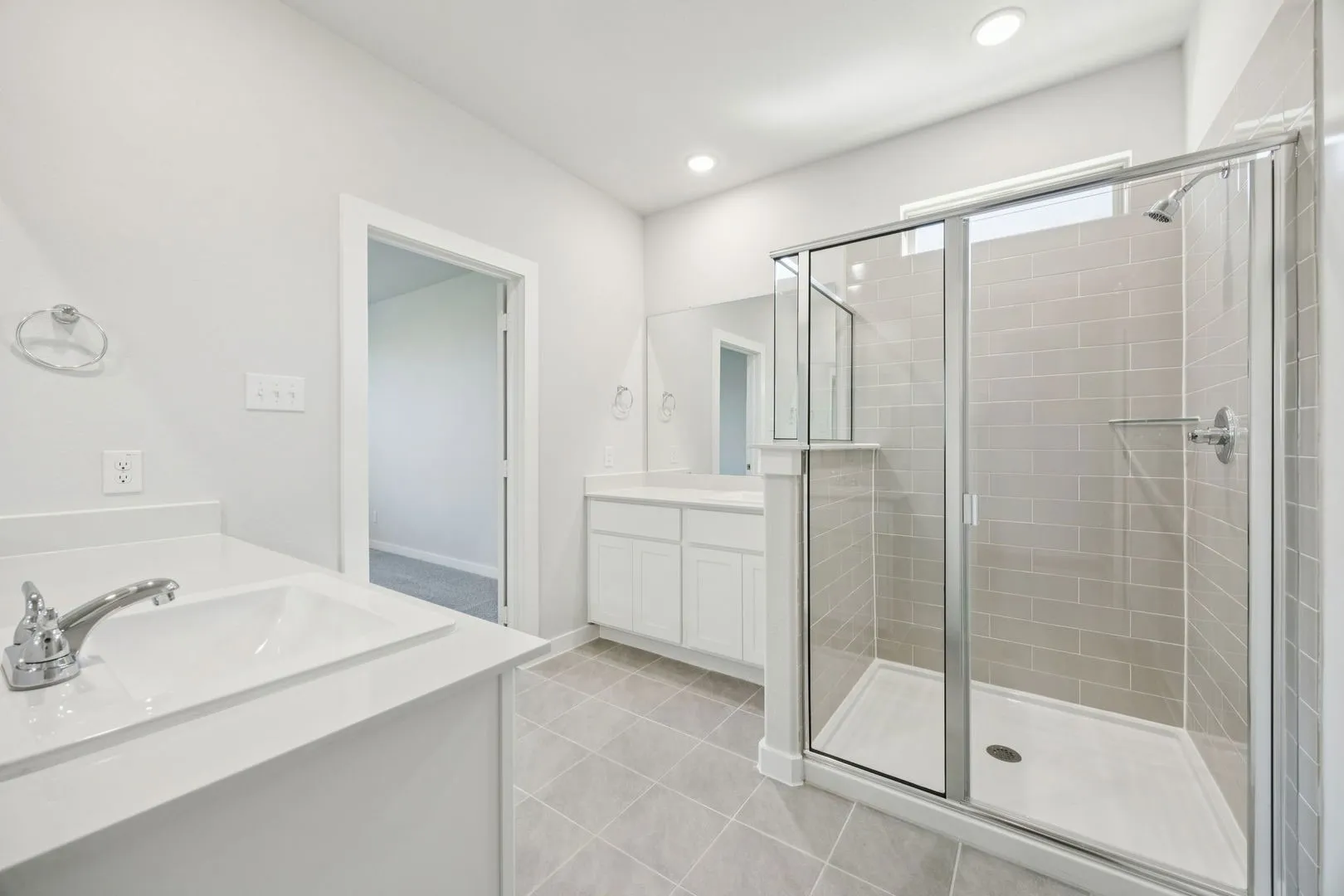 Primary Bathroom in the Masters home plan by Trophy Signature Homes – REPRESENTATIVE PHOTO