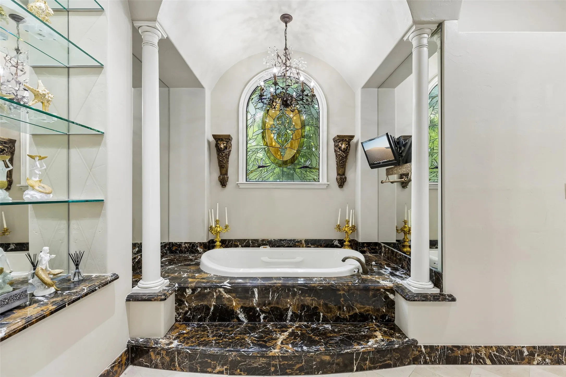 Soaking tub in primary bedroom suite
