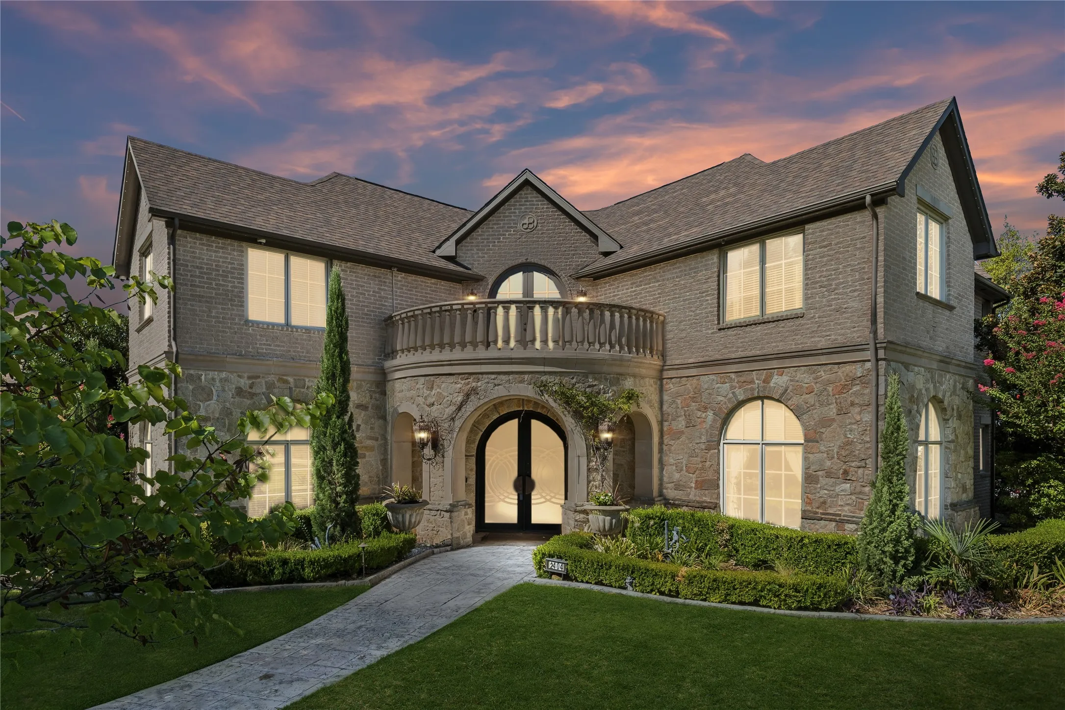 Grand entry with double iron entry doors and Juliet balcony