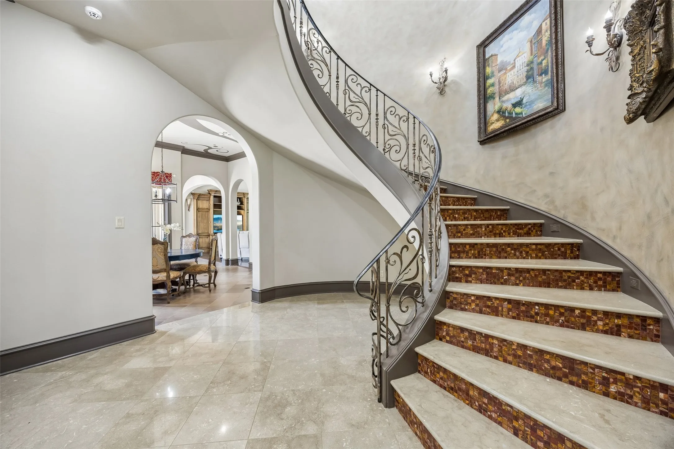 Gorgeous spiral staircase grades the middle of the home