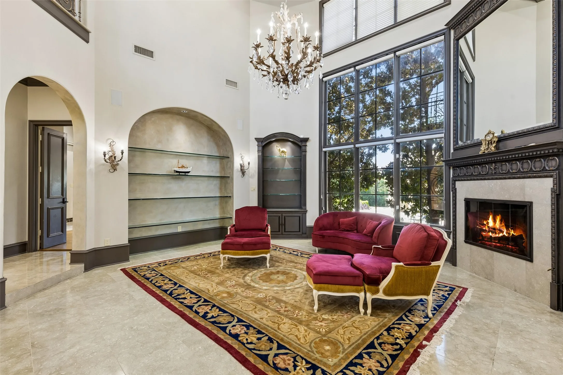 An enormous chandelier commands attention in the formal living room