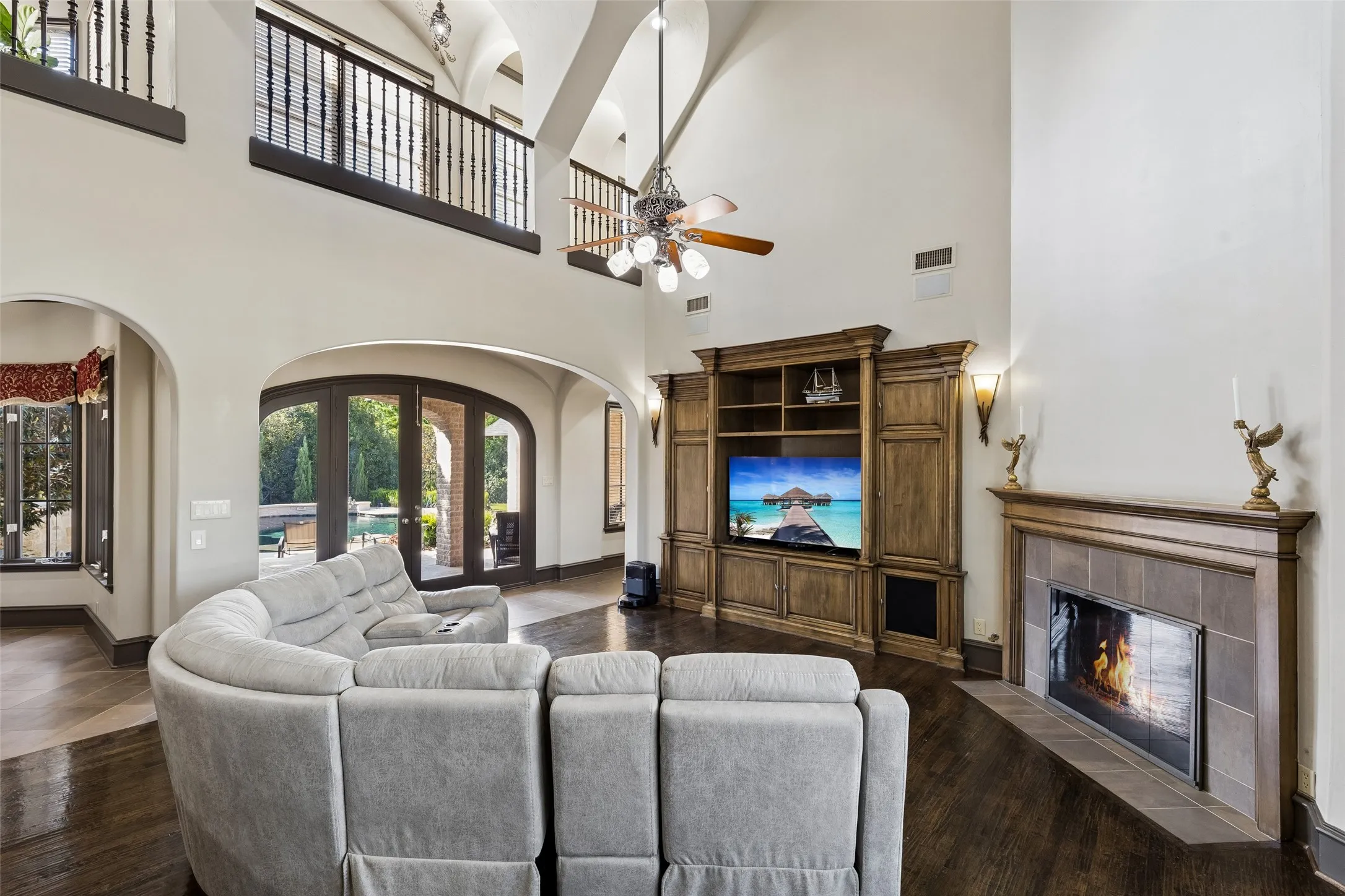 View from kitchen to family room, upstairs and outside