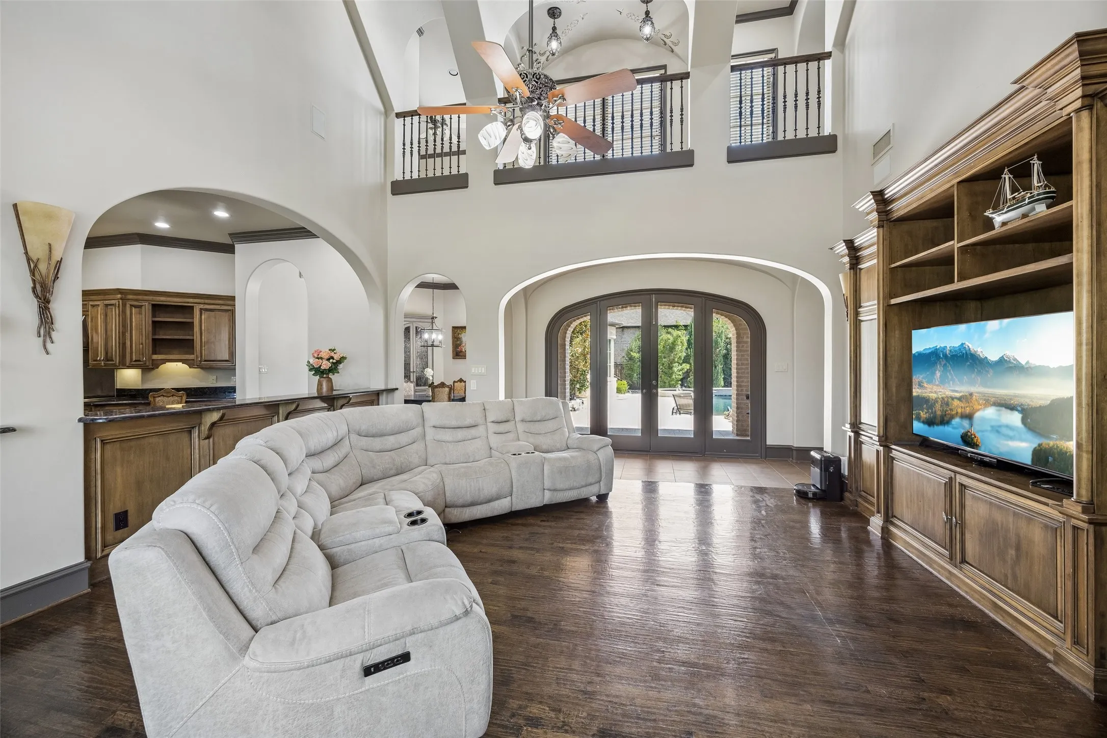 Second living area is cozier and features built-ins and a wet bar