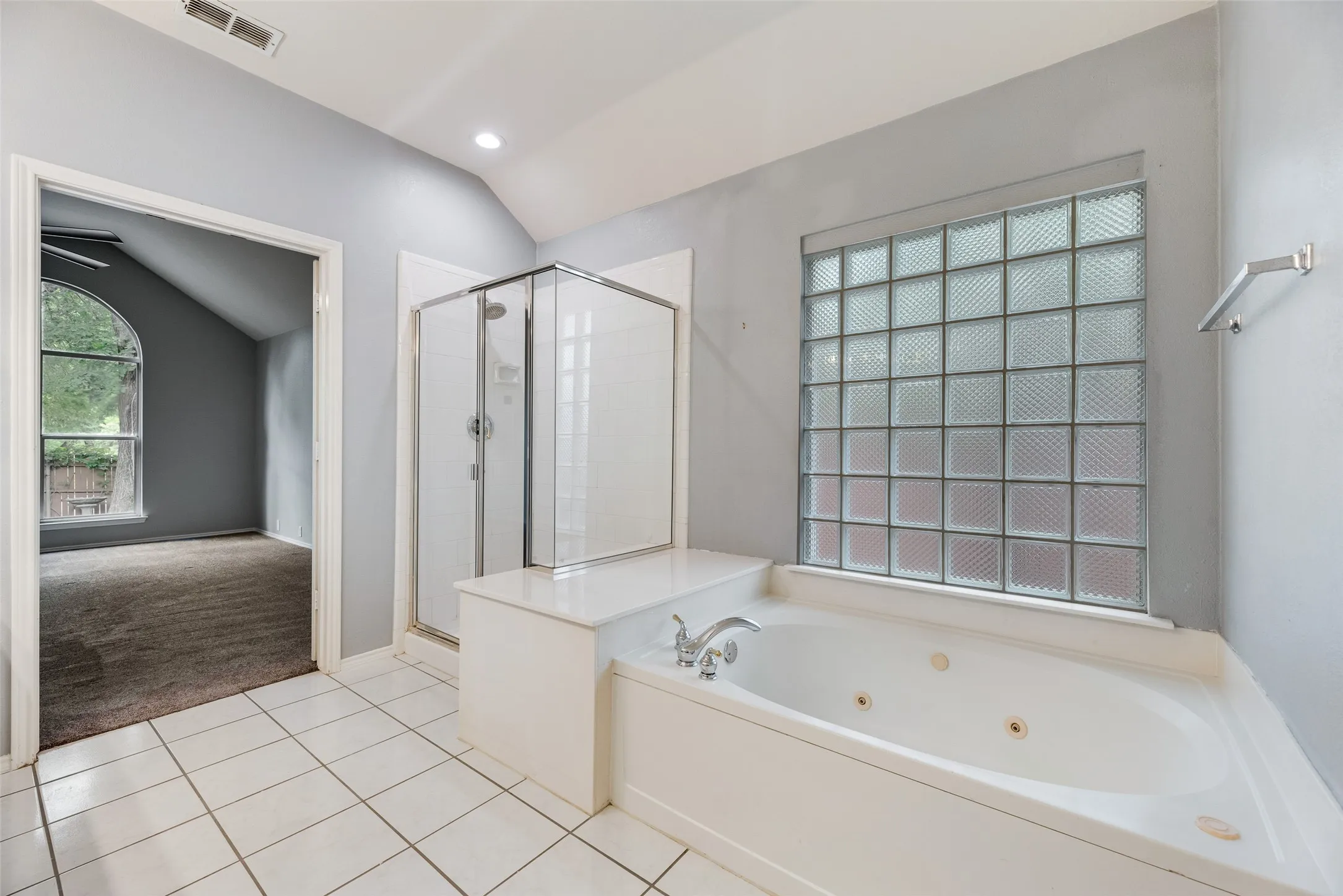 White tile flooring with a recessed lighting fixture