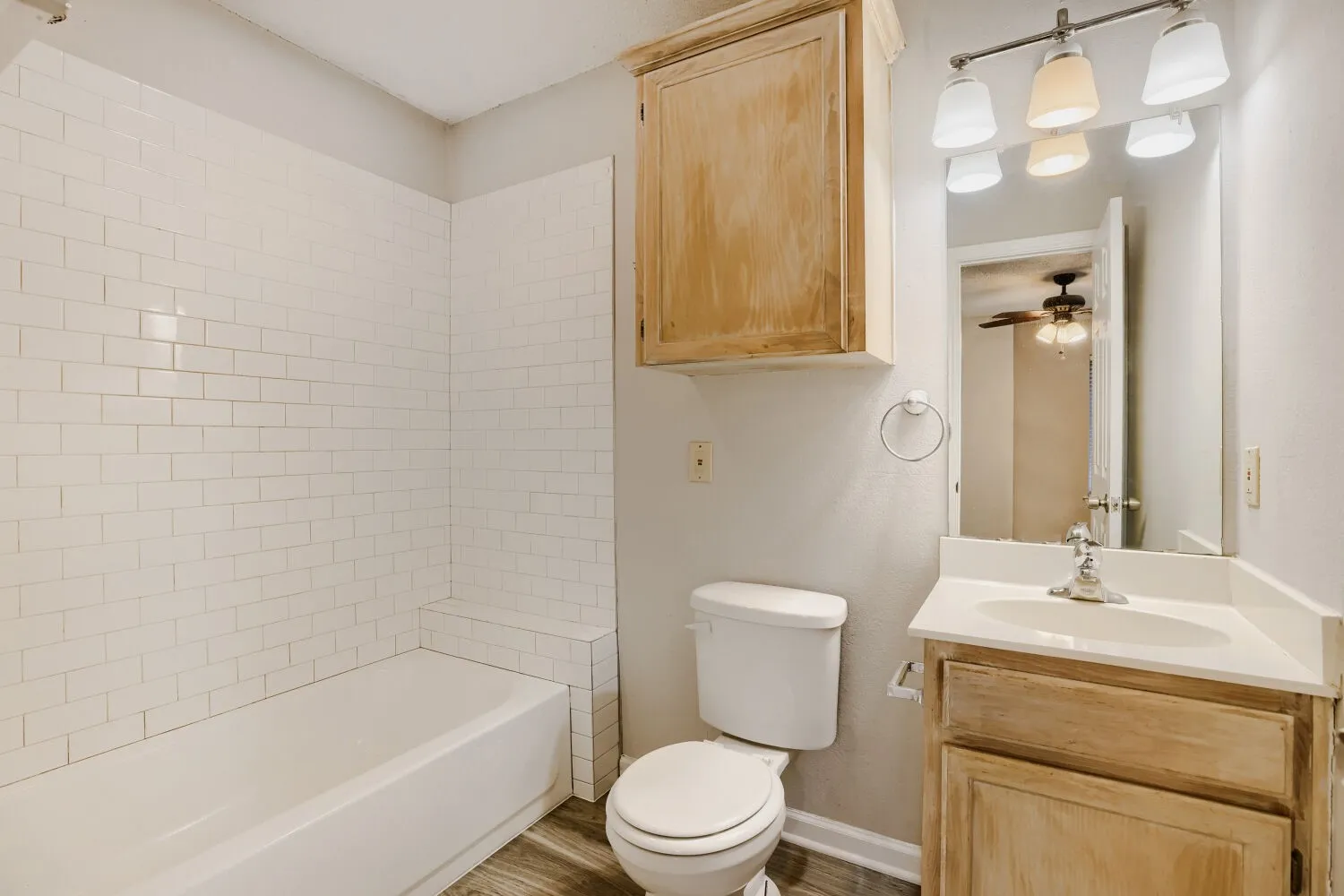 White subway tile shower surround with integrated bench
