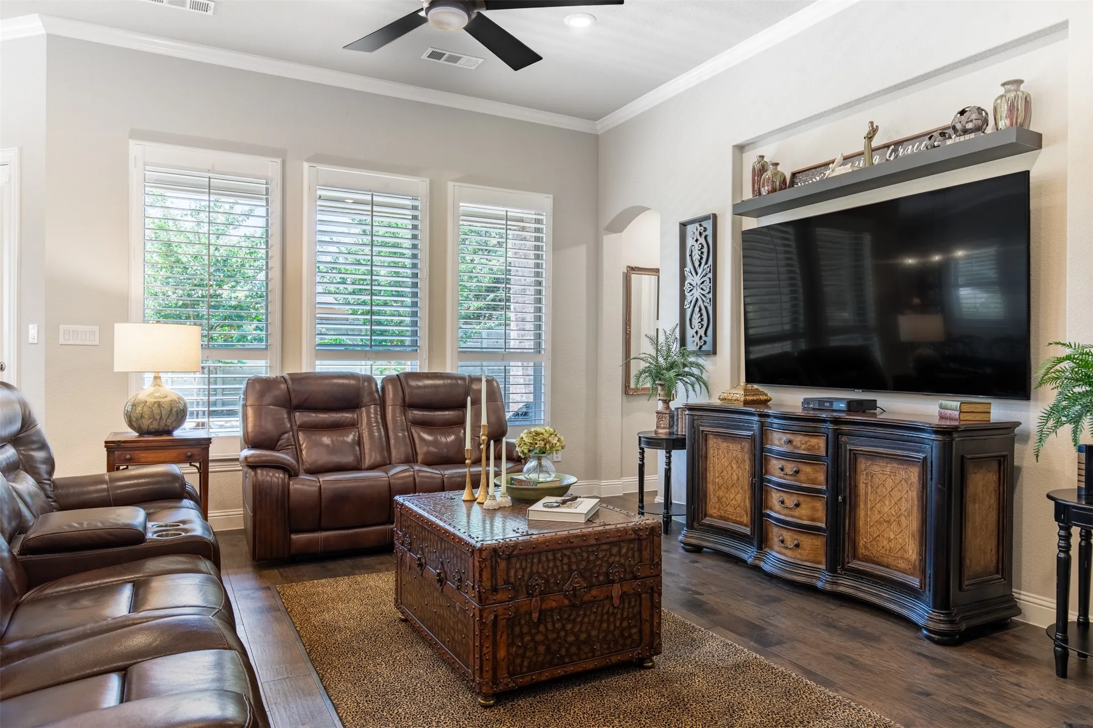 Large family room with beautiful flooring and wood shutters.  You need to see this room in person to understand how large it is!