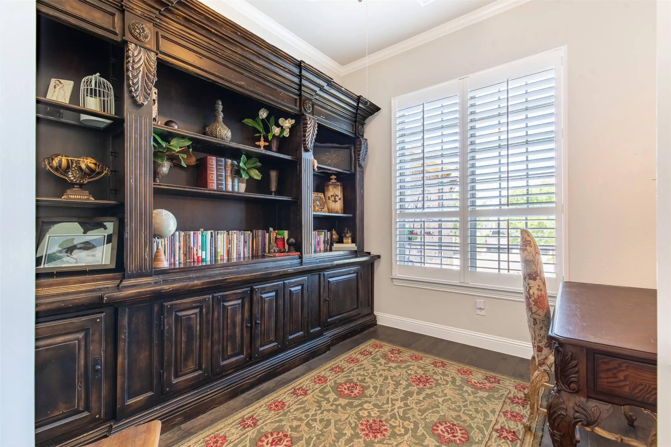 This bright, airy study is quiet and peaceful. The shutters let in plenty of natural light, making the whole room feel  welcoming.