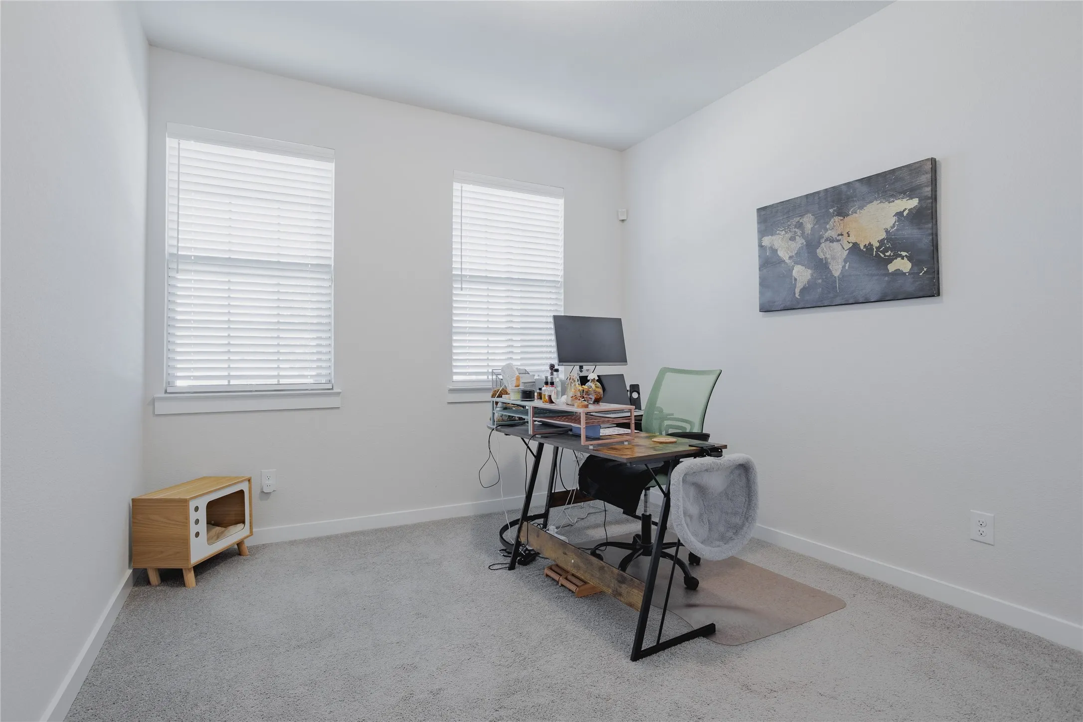 Bedroom is downstairs and currently used as an office. Light grey carpeting