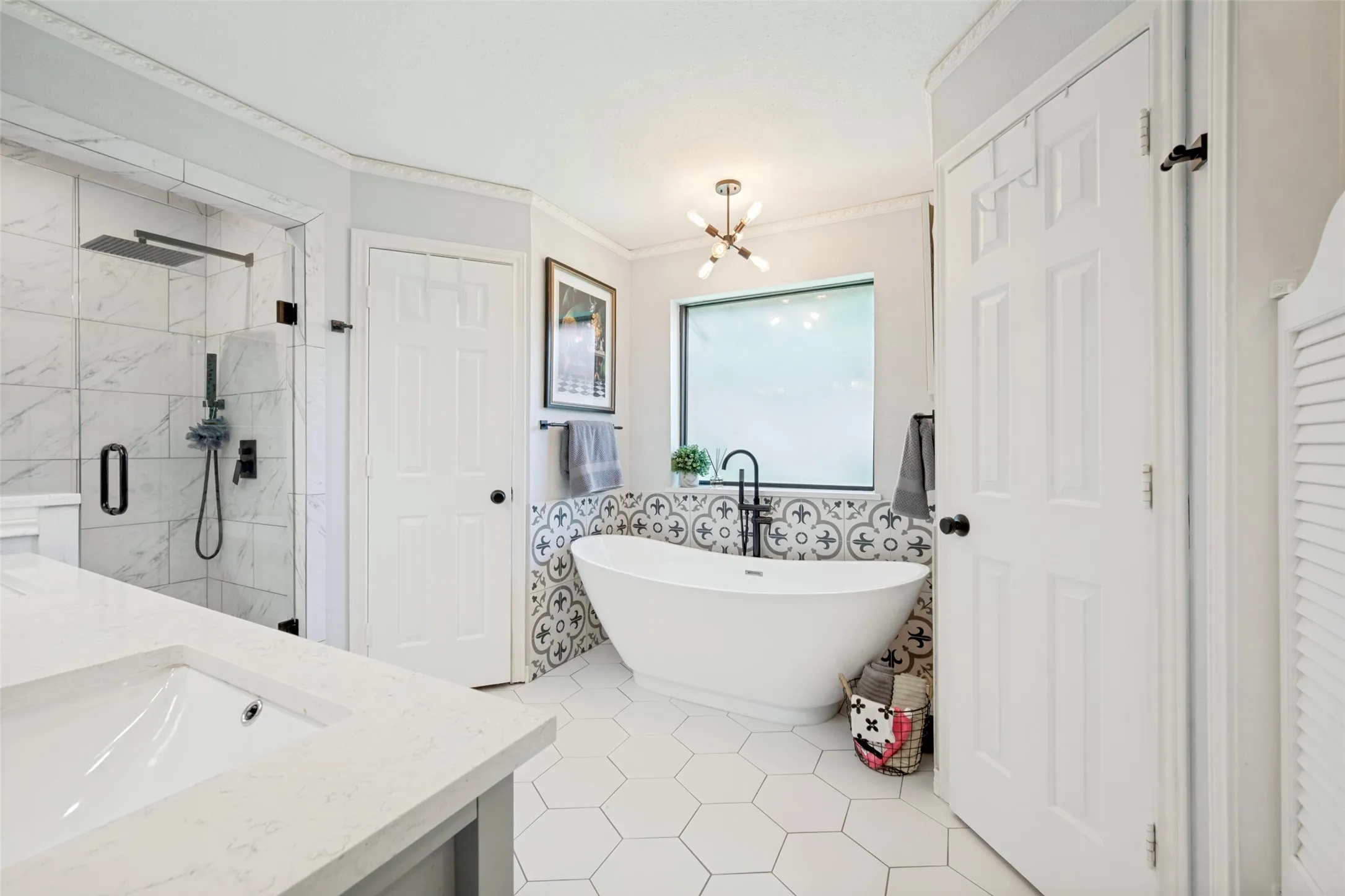 OOOOOOOOOOOOOOOO LA LA says it all for this beautifully updated PRIMARY bath with dual closets and soaking tub with separate shower!