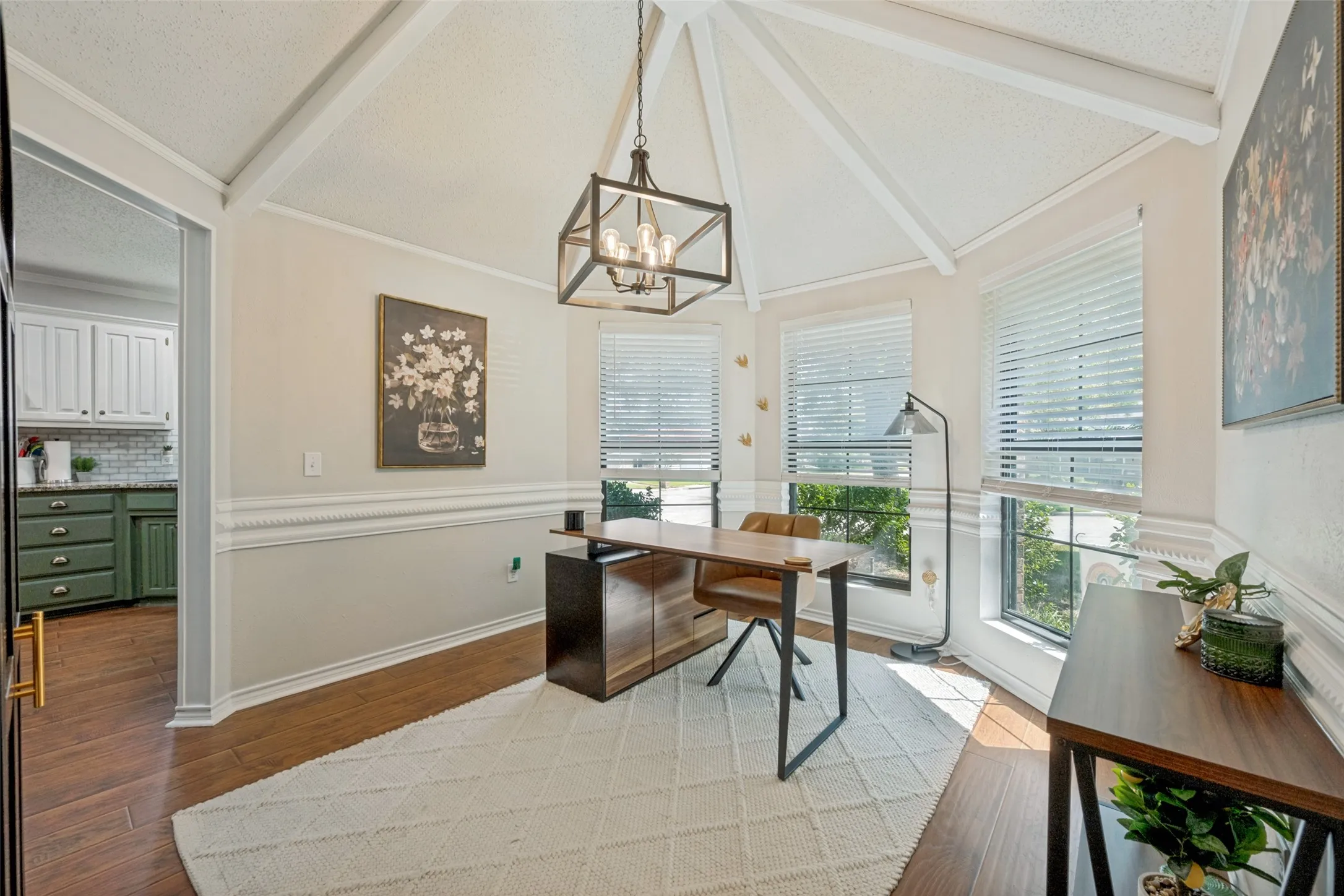 Dining OR office easily adaptable with gorgeous light fixture and open access to kitchen.