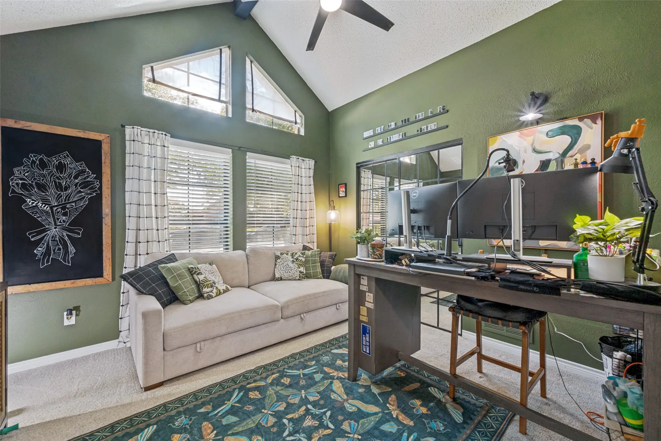 Secondary bedroom, currently used as an additional office space with so much natural light streaming in.
