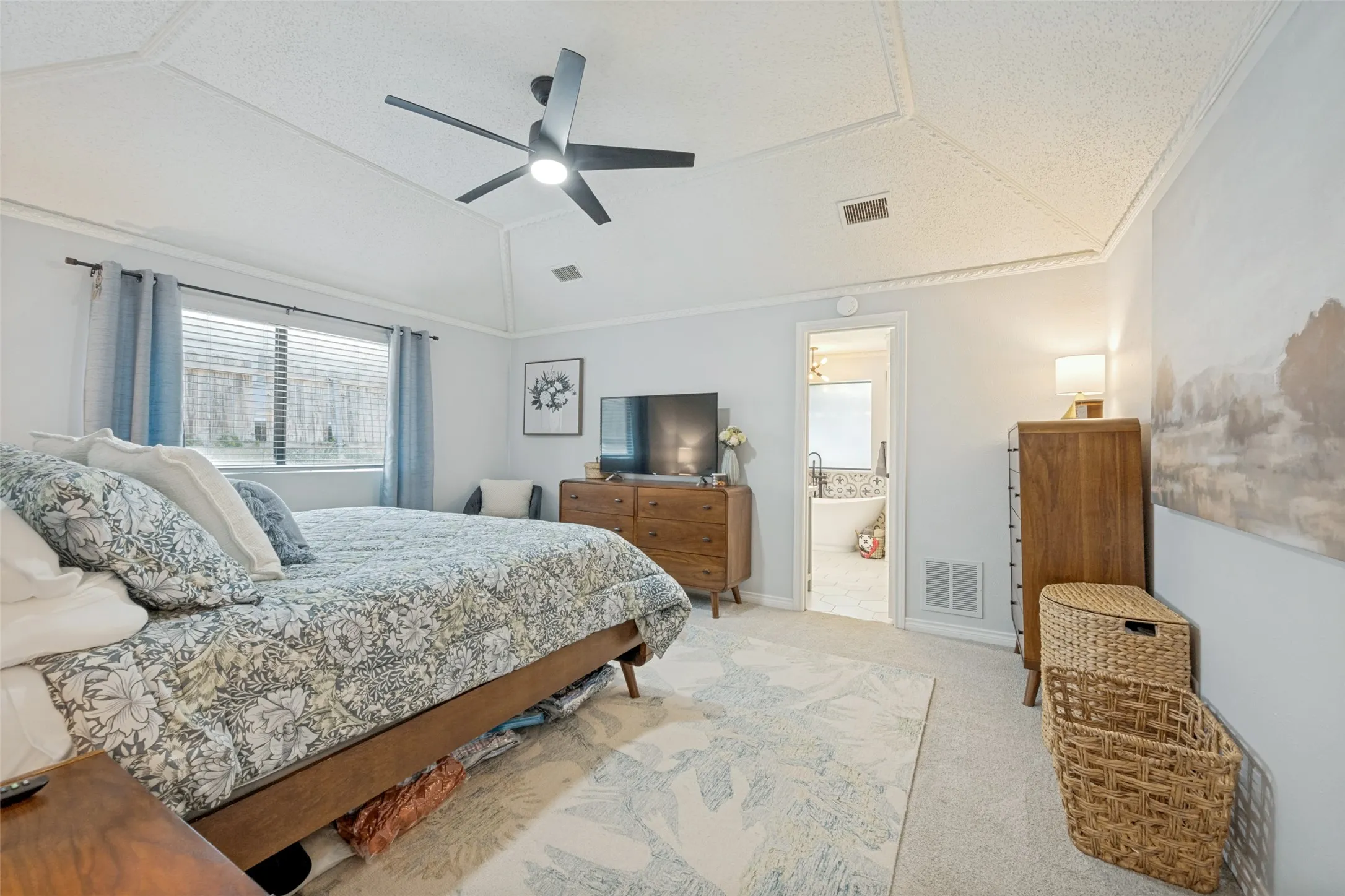 Primary Bedroom large enough for several pieces of furniture as well as bedside tables.